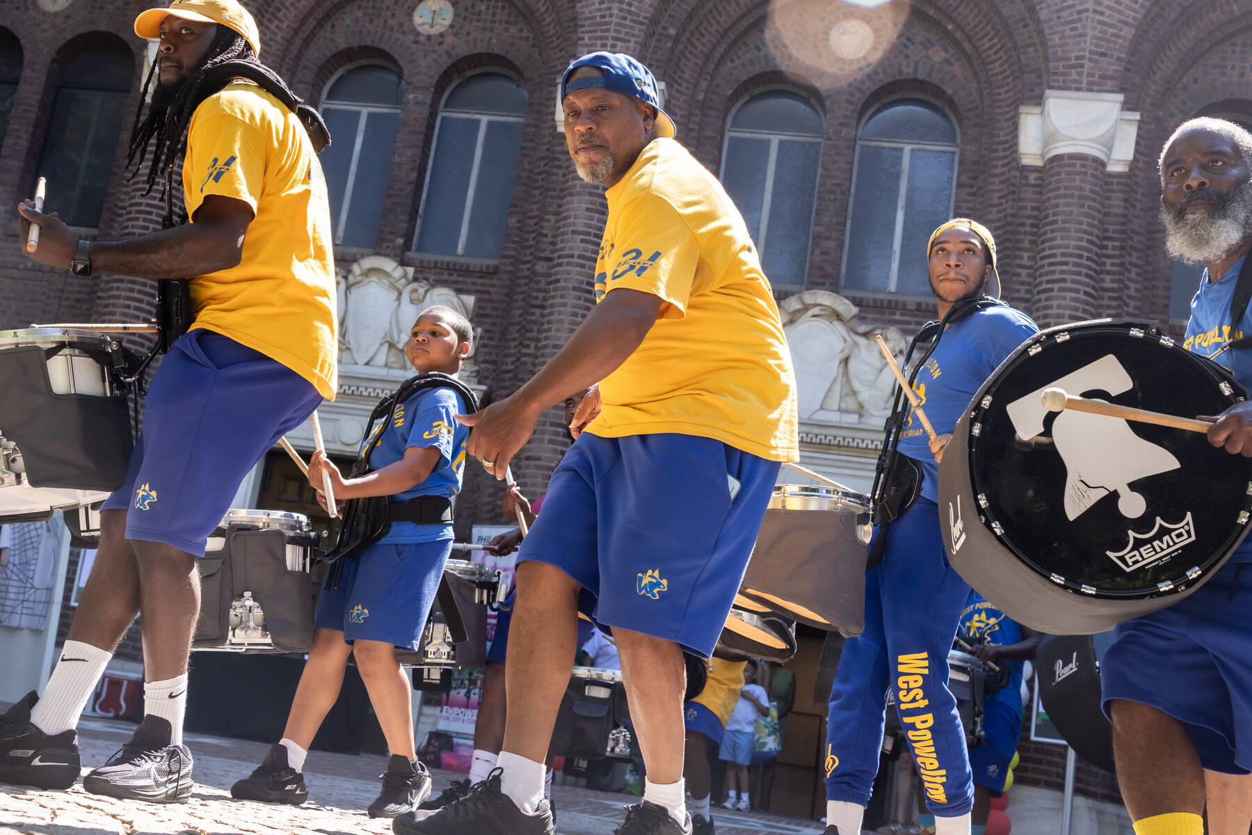A drumline performing outside the penn museum.