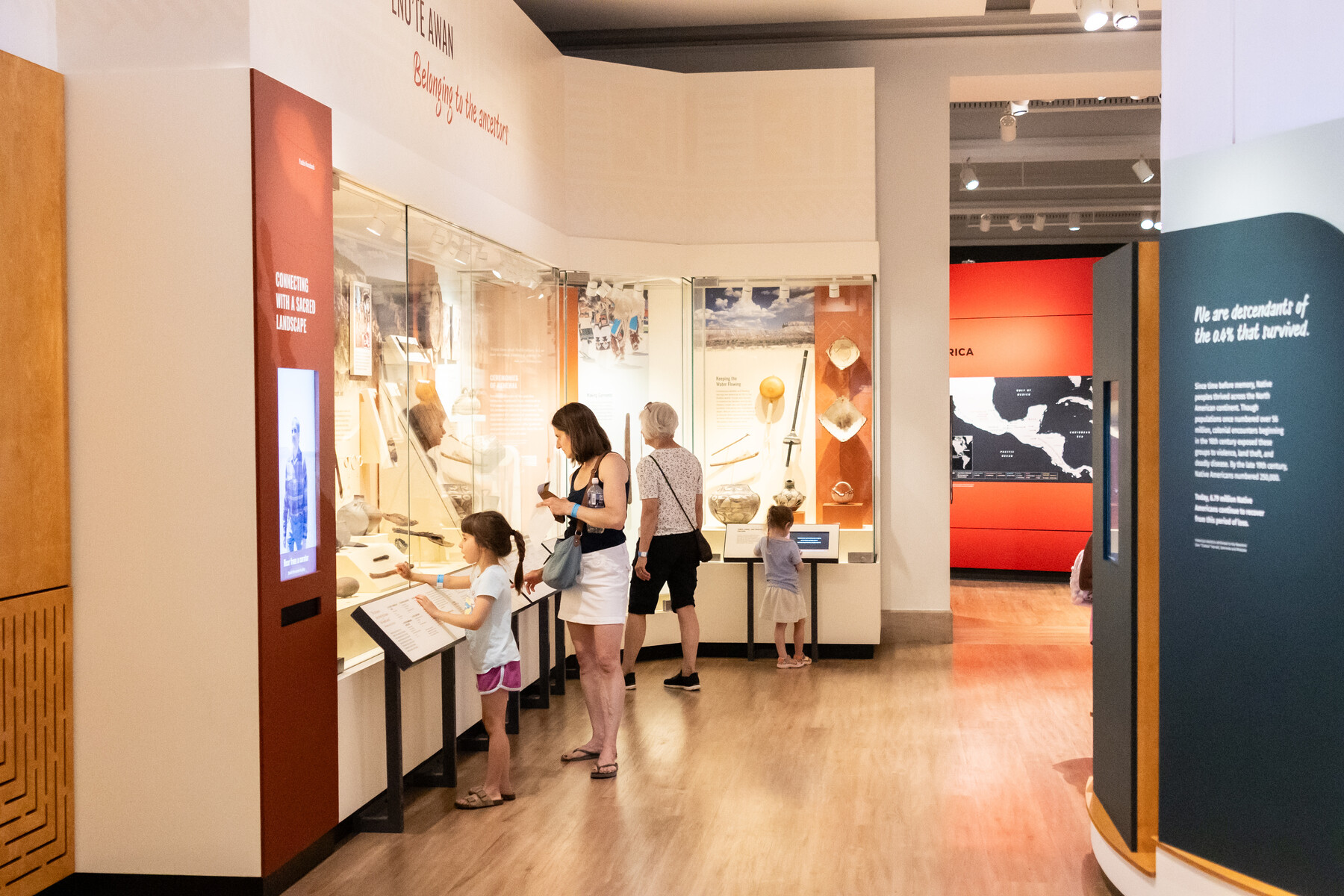 Visitors at the Penn Museum looking at an exhibit.