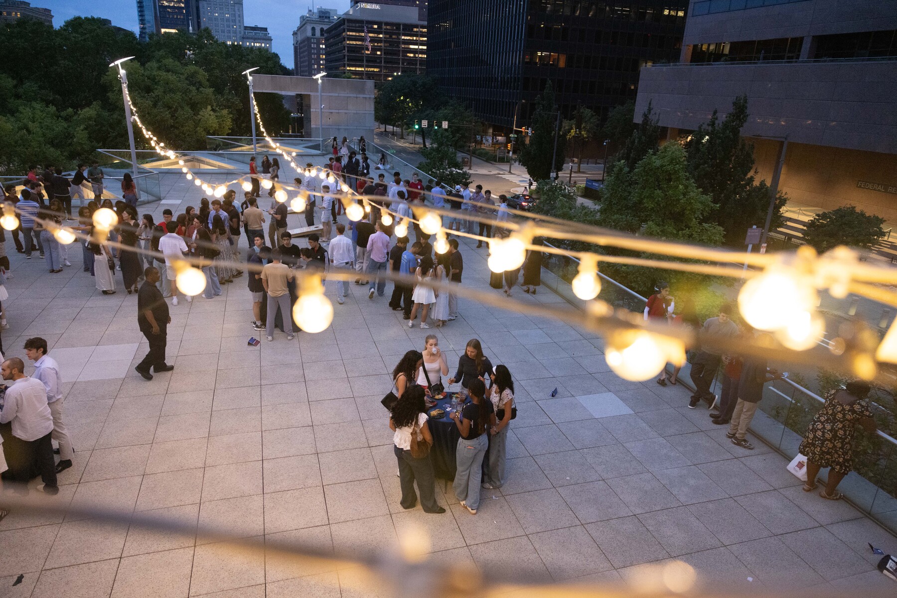 Penn students in the courtyard of the Constitution Center in the evening.