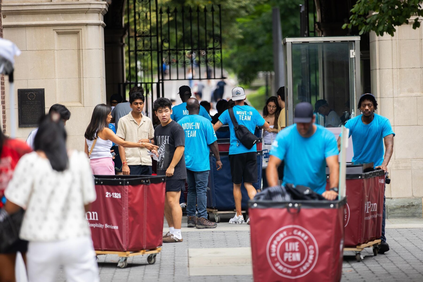 Move-in carts and crew outside the Quad.