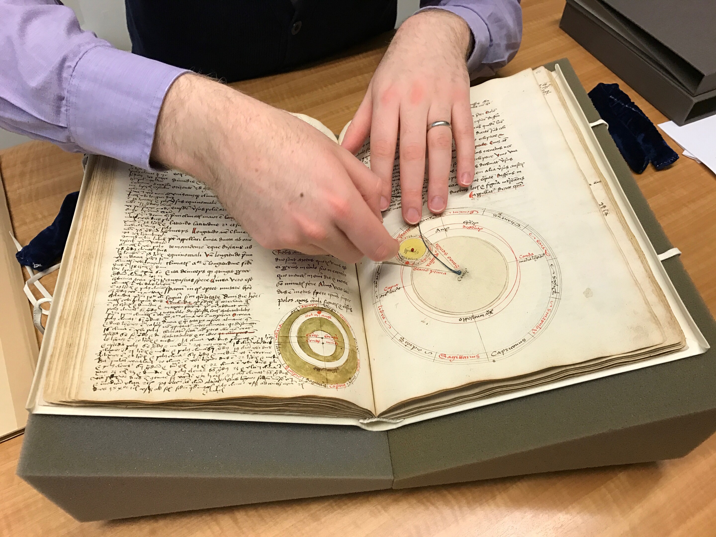 Penn Libraries curator Nicholas Herman with medieval manuscript. 