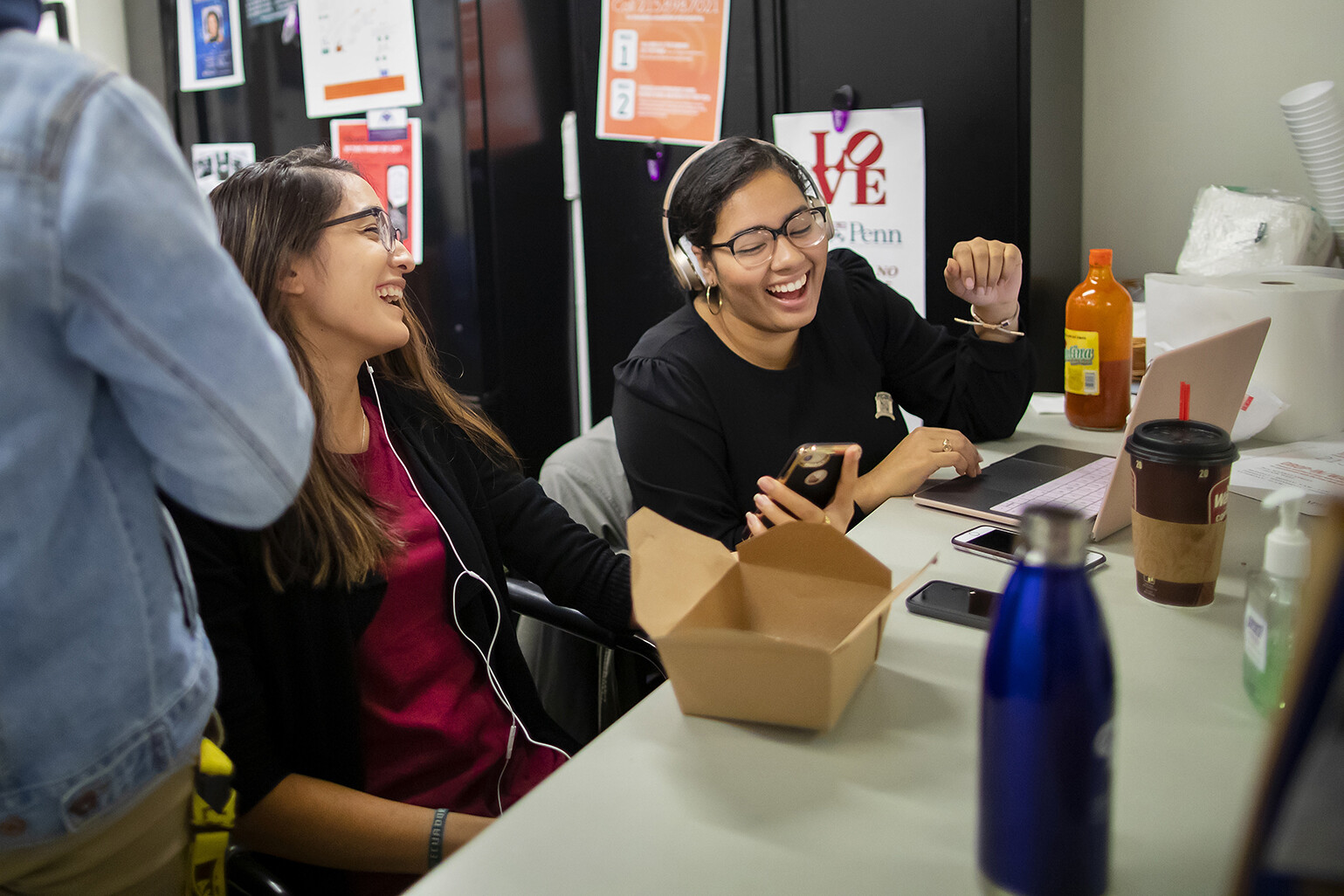 Students laughing at La Casa Latina while eating lunch