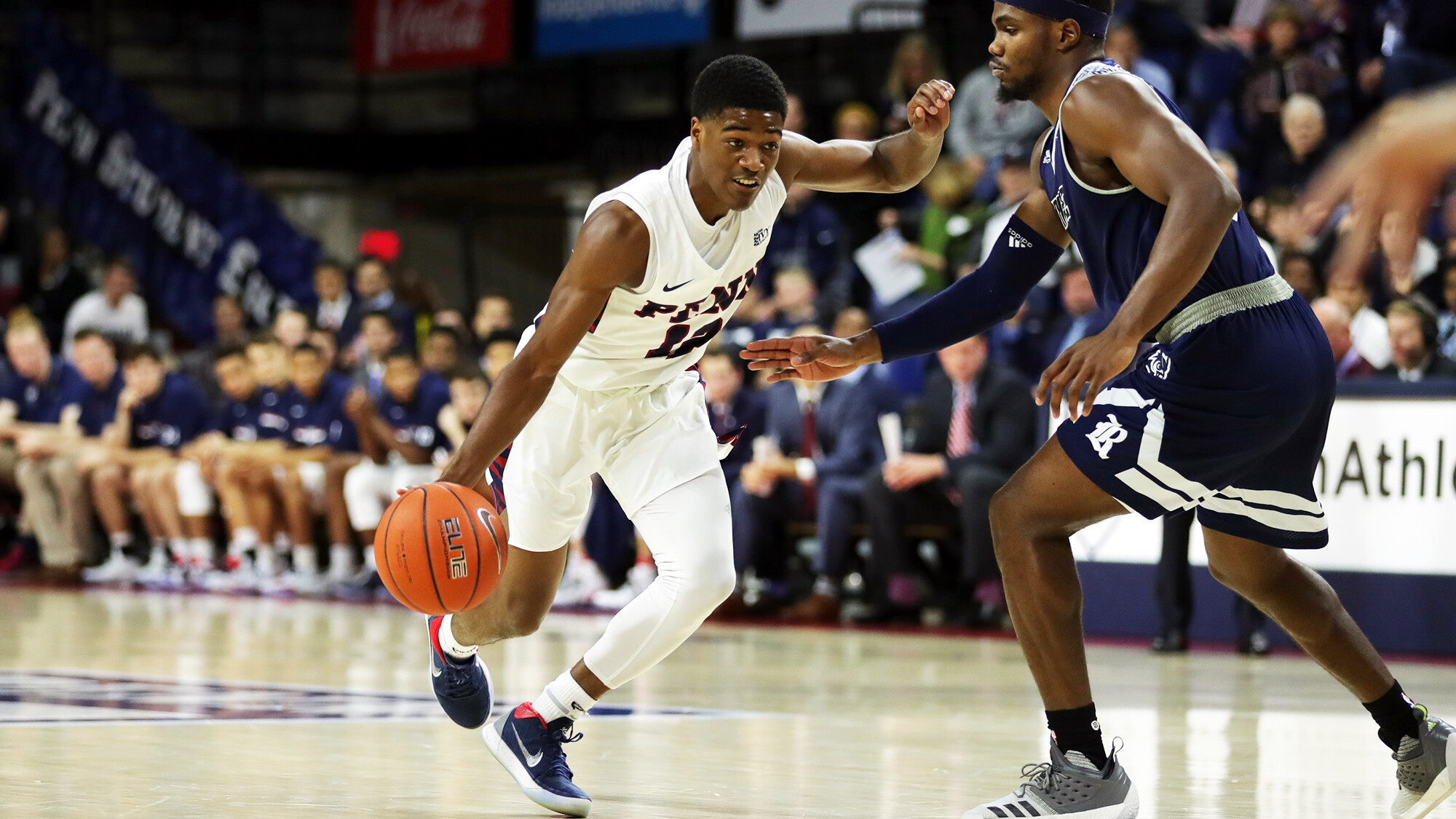 Devon Goodman dribbles down the court