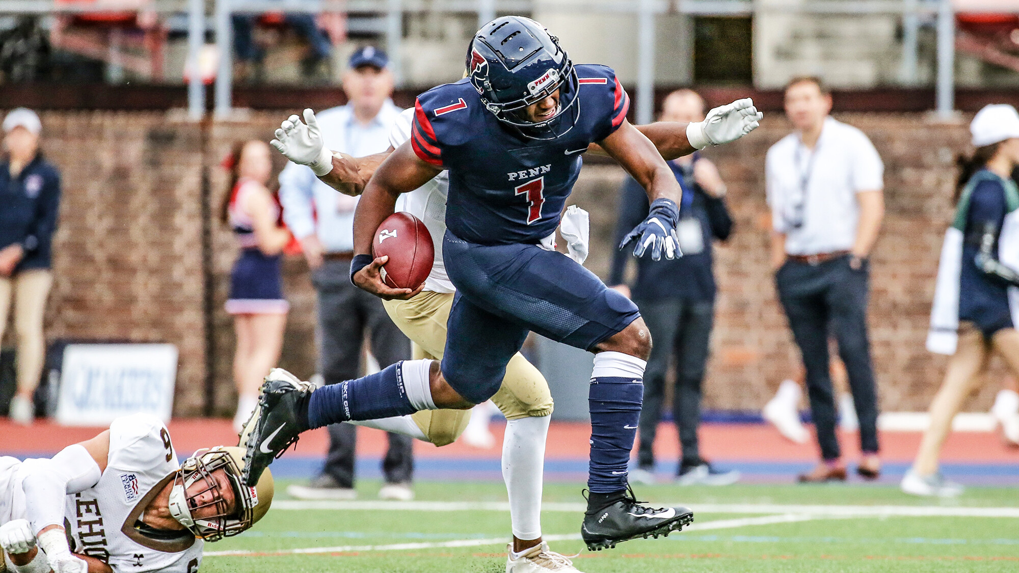 Ryan Glover runs down the field with the football