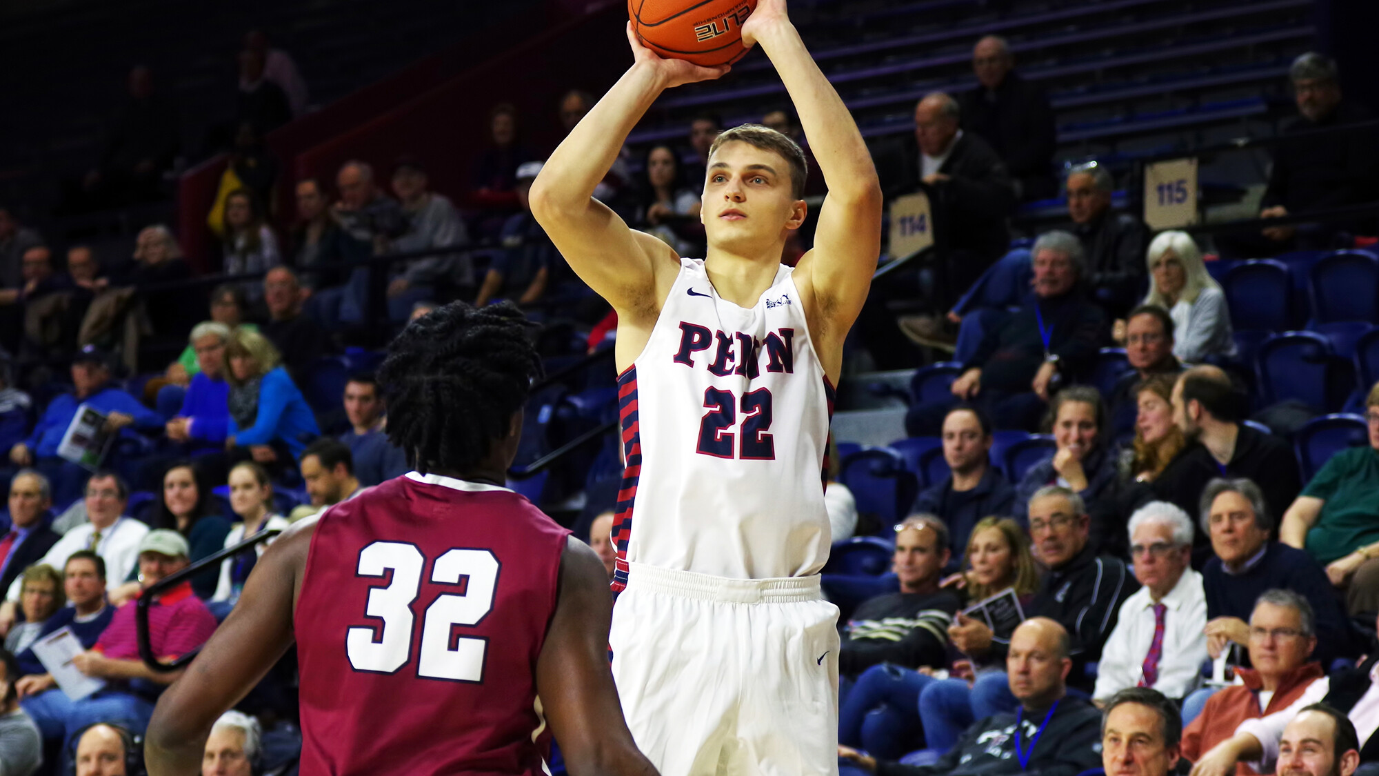 Kuba Mijakowski of the men's basketball team shoots a jump shot.