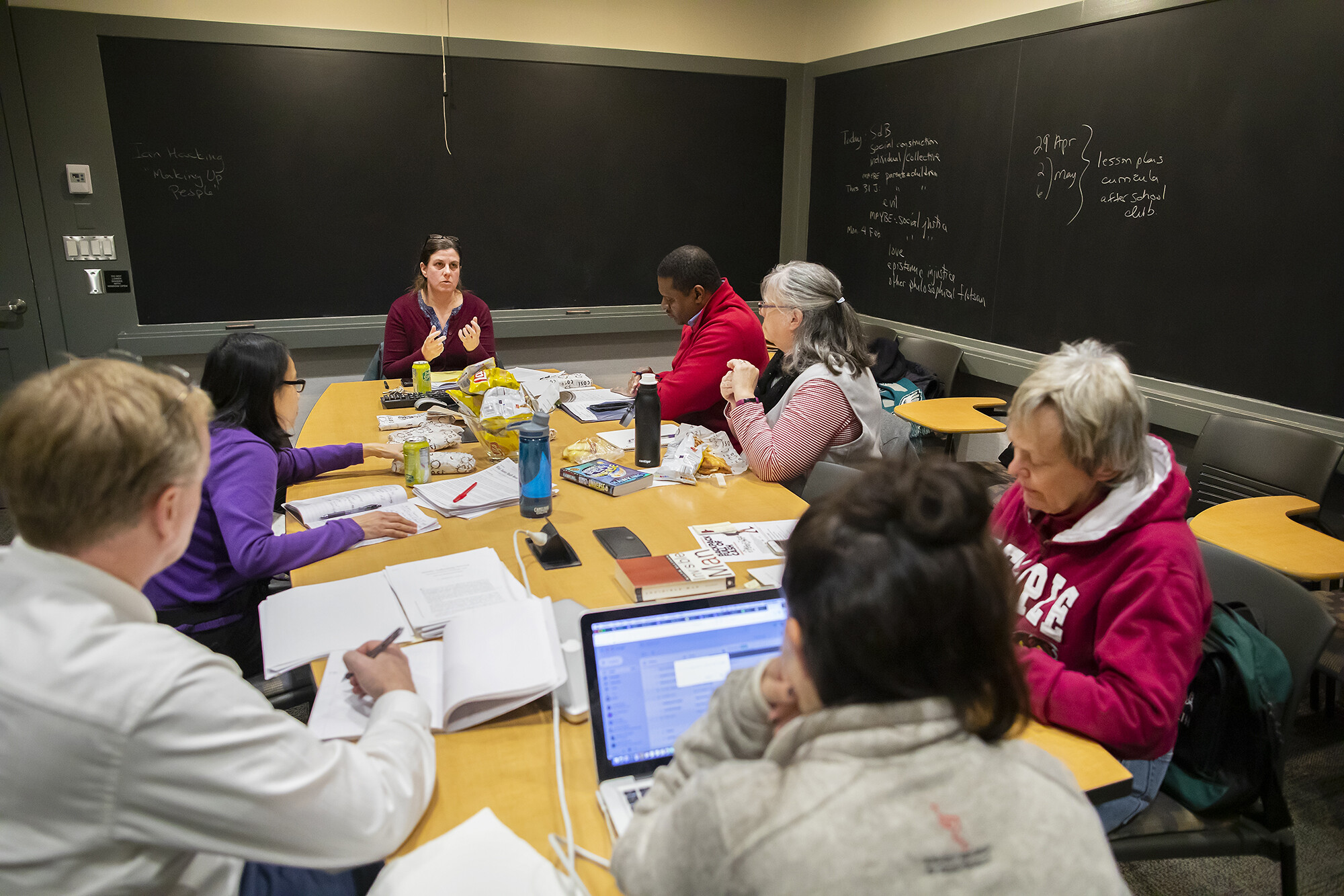 Philosophy professor Karen Detlefsen with other teachers around a table