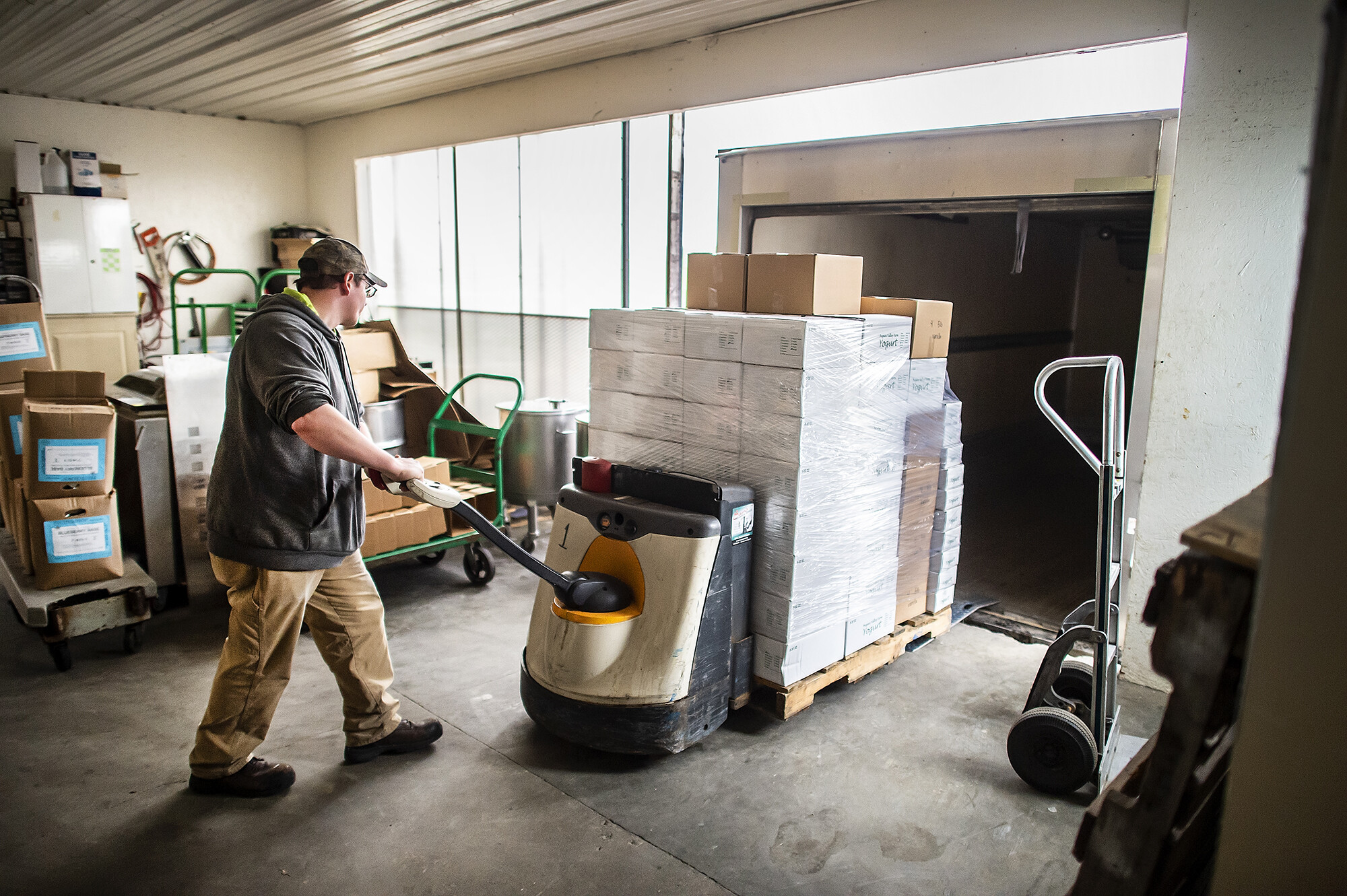 loading a truck with yogurt for penn dining