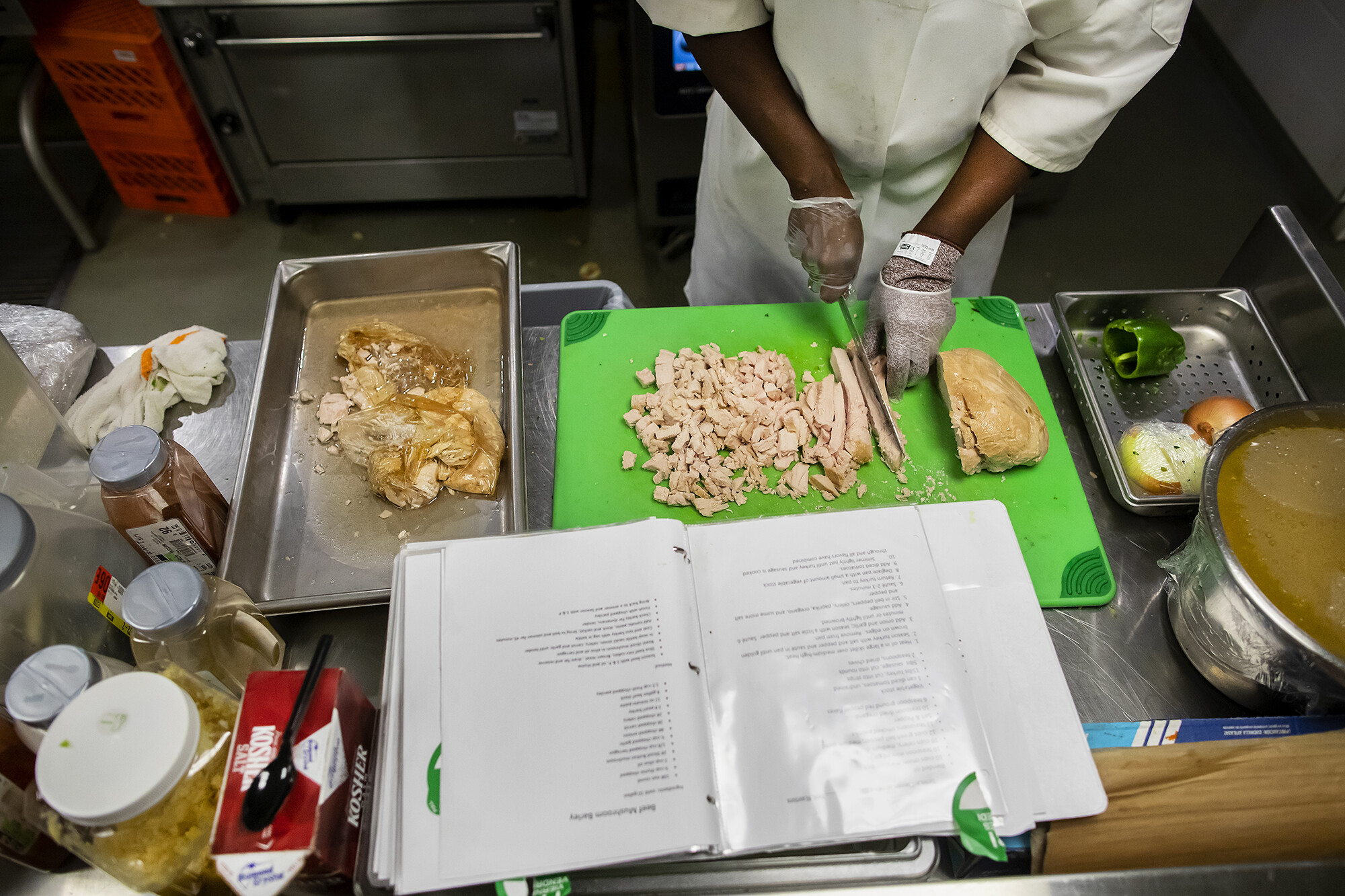 cutting chicken in the penn dining kitchen
