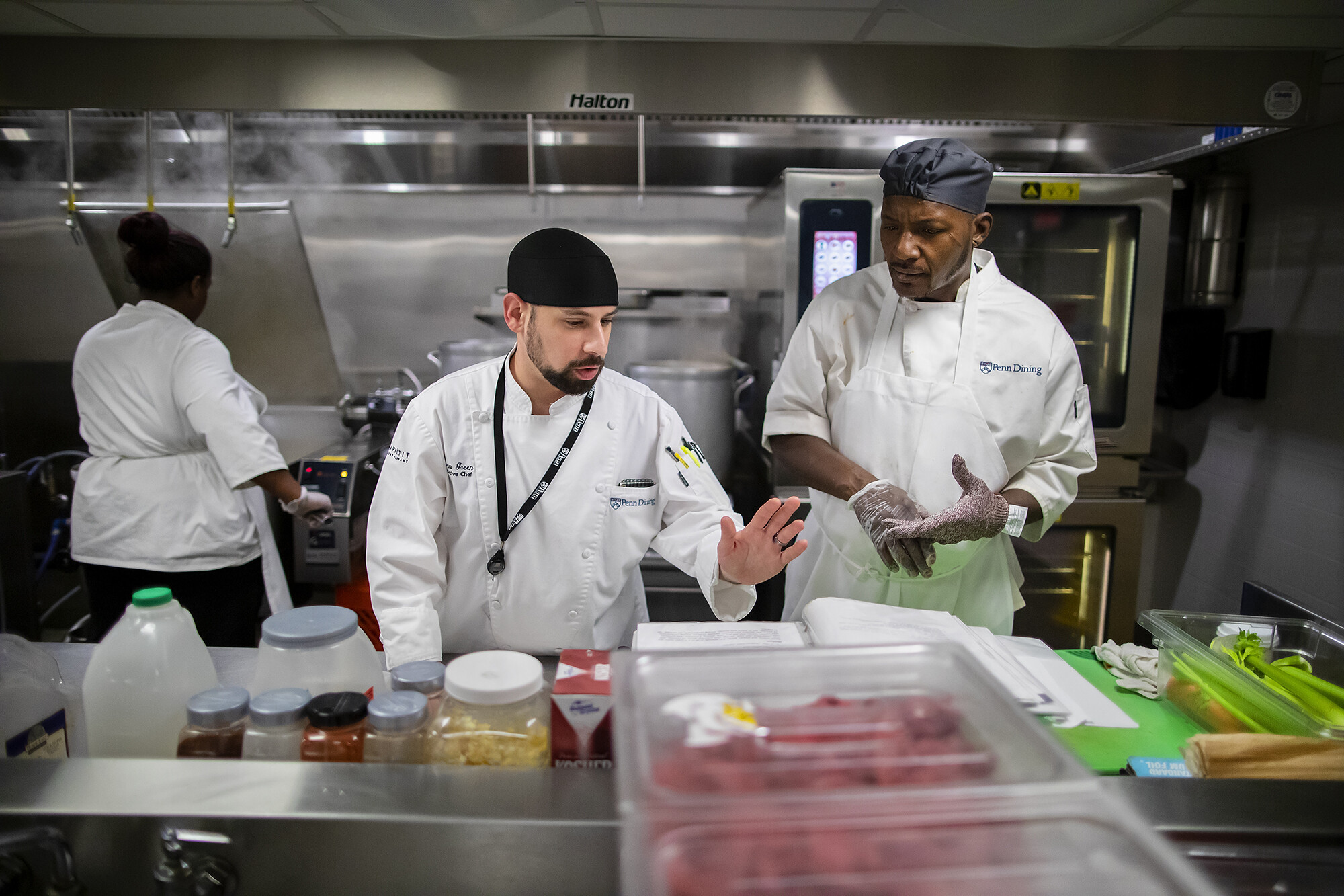 chef green preparing food at penn dining