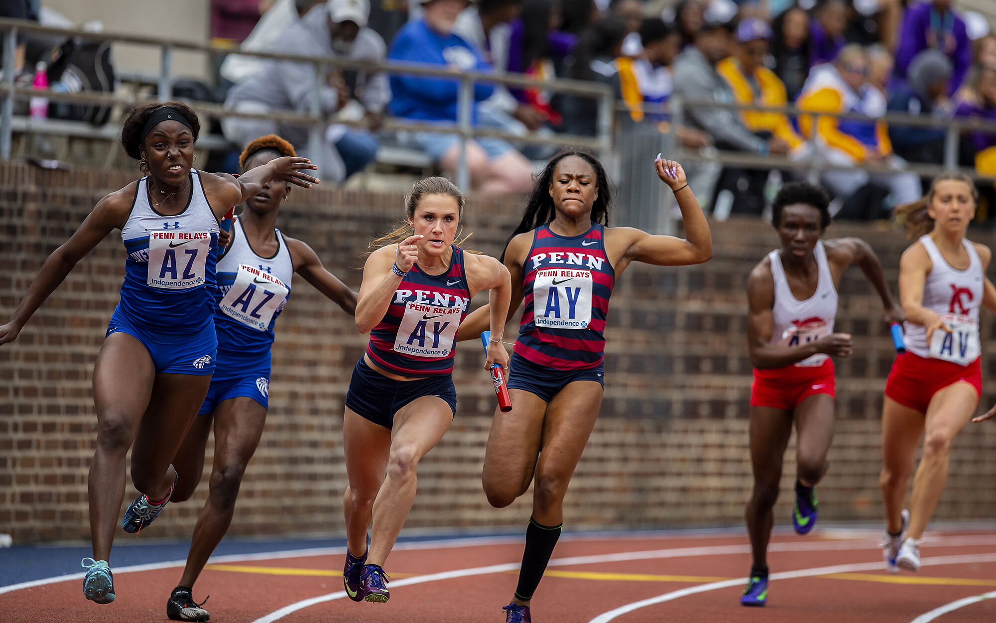 Camille Dickson and Mia Knight compete in the Women’s 4x100 