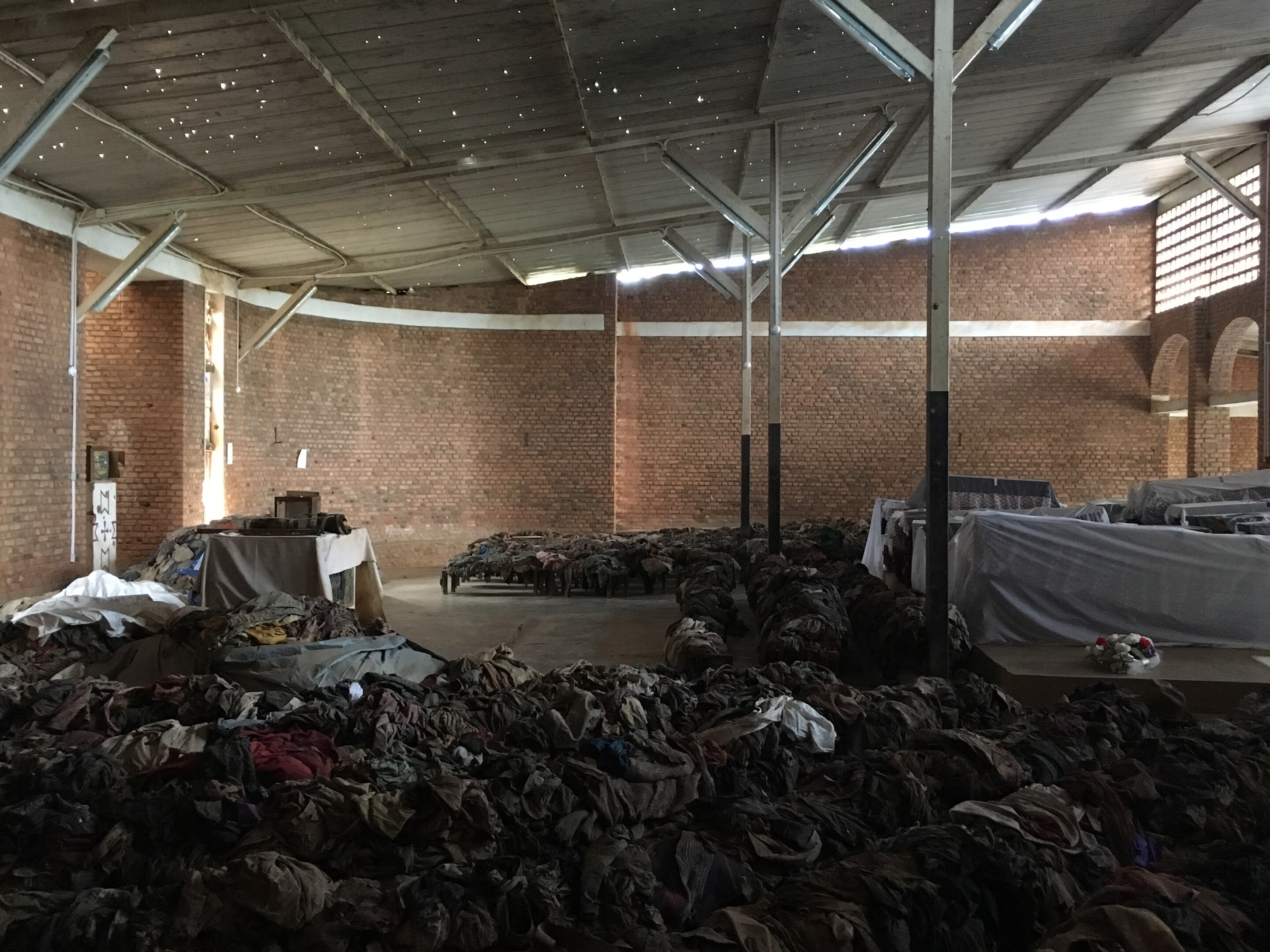 piles of soiled clothing and sheets on church pews and floor