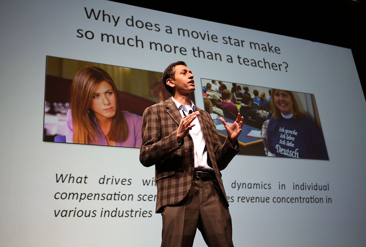 Kartik Hosanagar speaking on stage