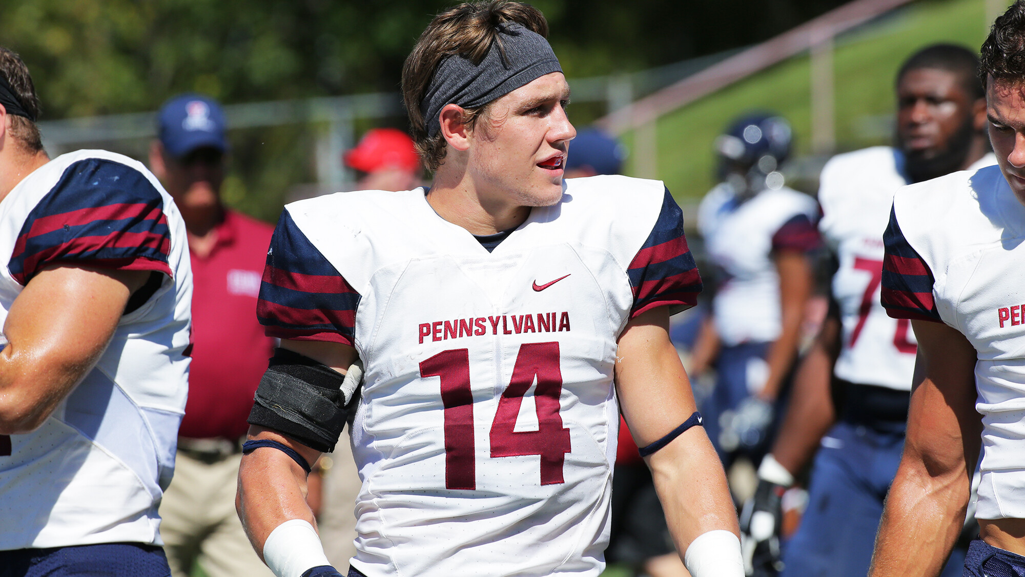 Senior defensive back Sam Philippi stands on the field with his helmet off.