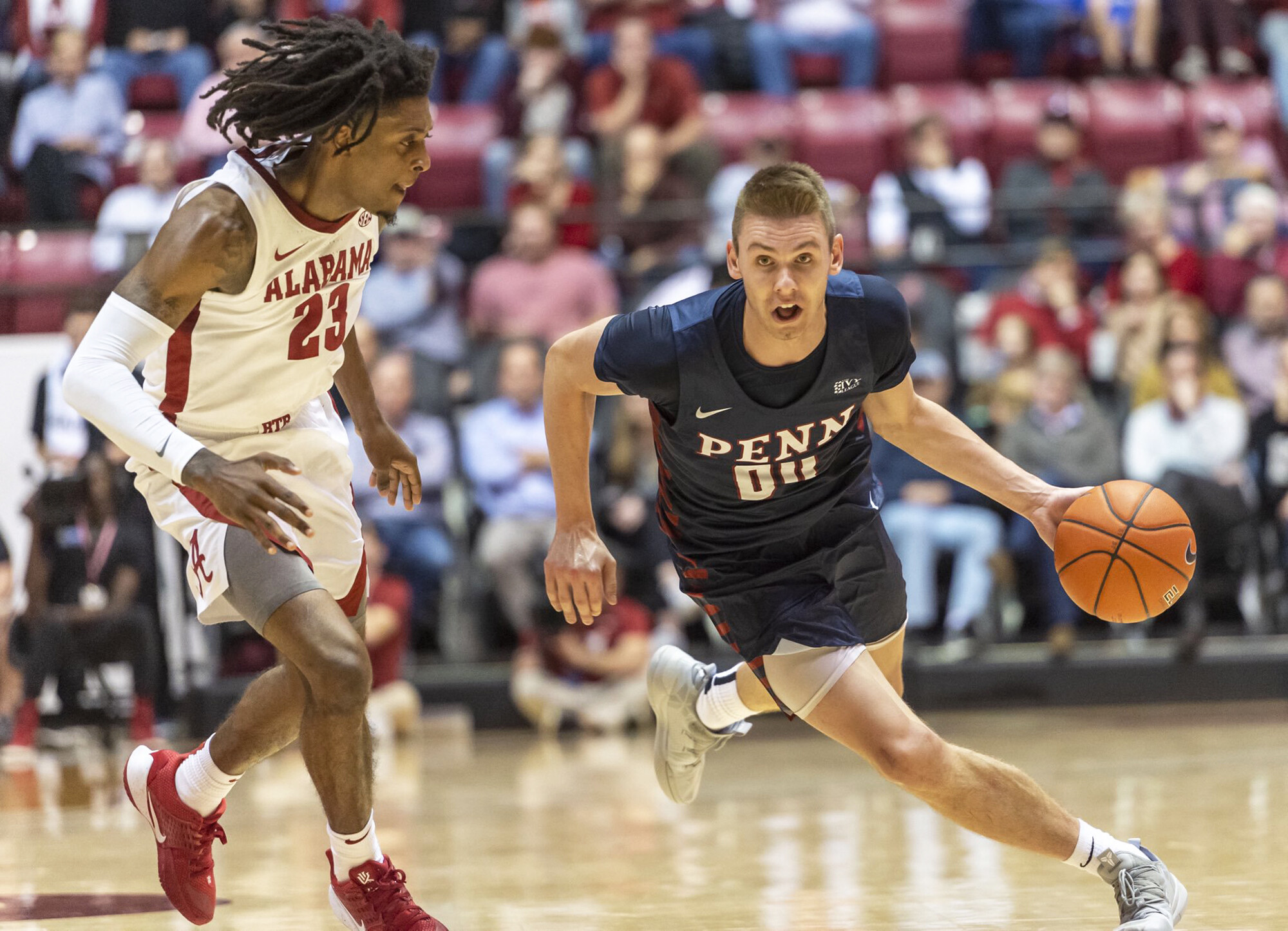 Senior guard Ryan Betley drives to the basketball against Alabama.