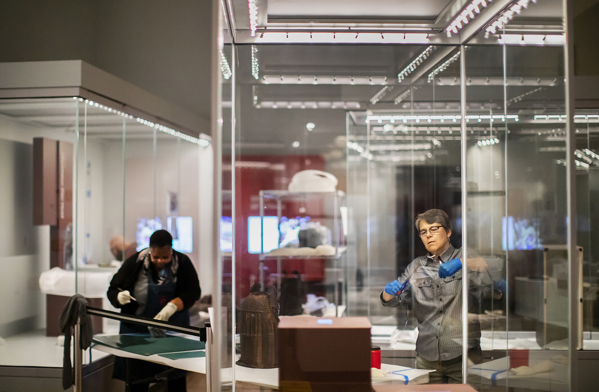 two museum worker renovating in the africa gallery