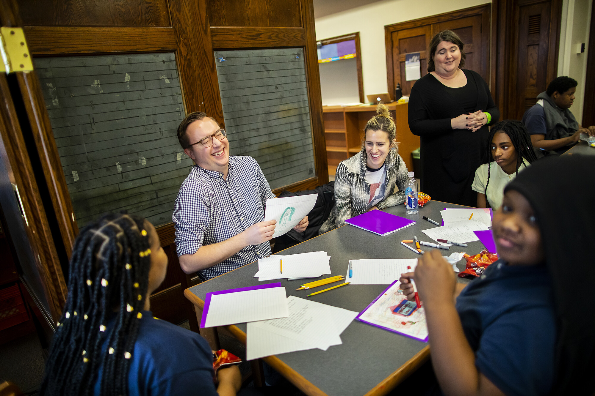 students and mentors around a table