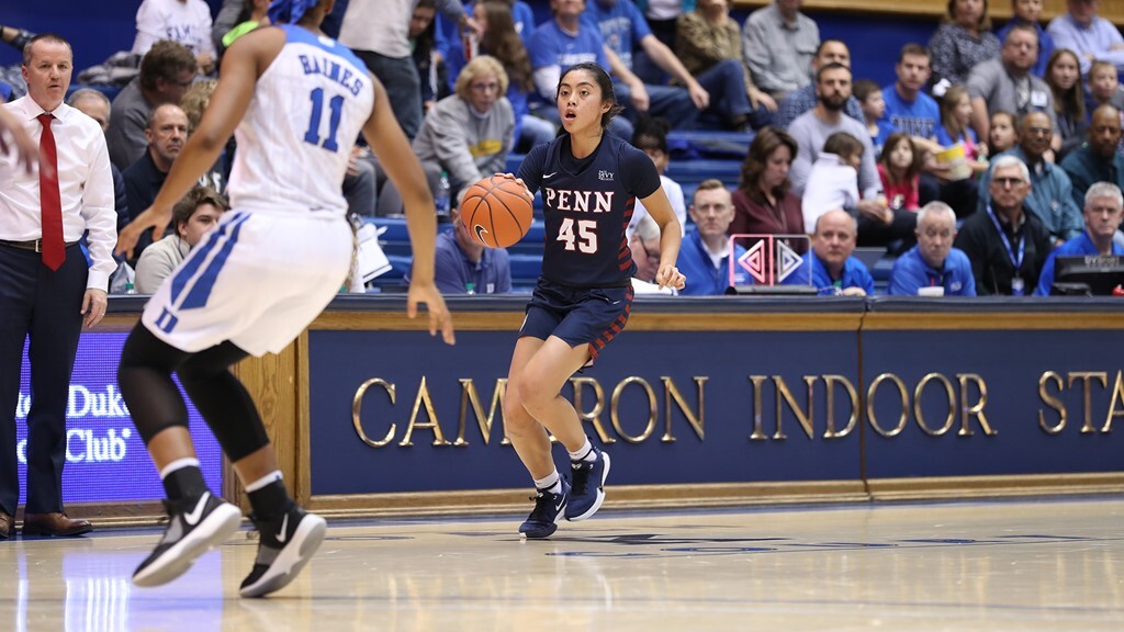Kayla Padilla dribbles a basketball down the court