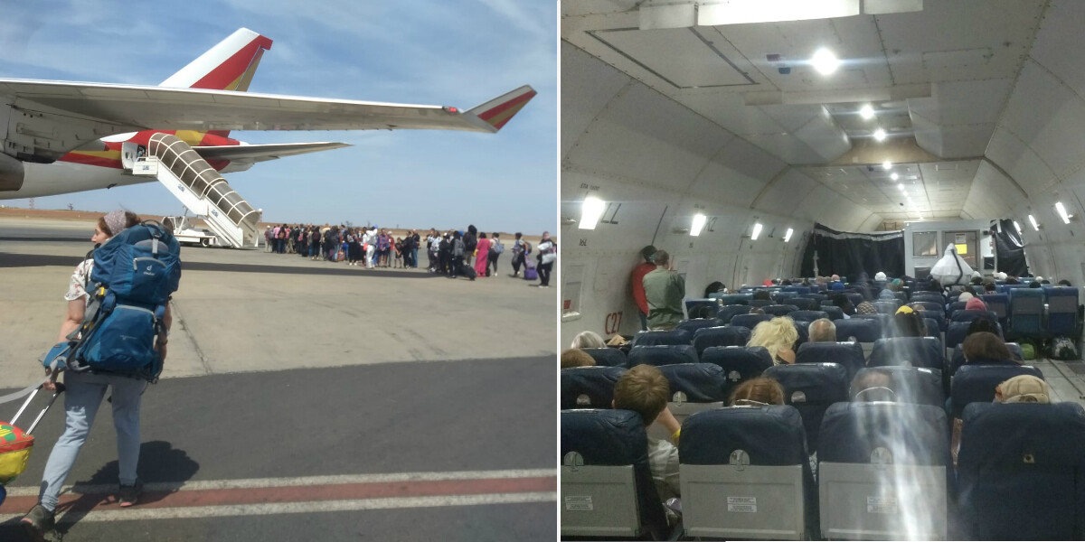 Side by side person pulls a bag across tarmac towards a large plane. Inside the aircraft light streams from small high windows with seats below and person in hazmat suit at the front of the belly of the plane.