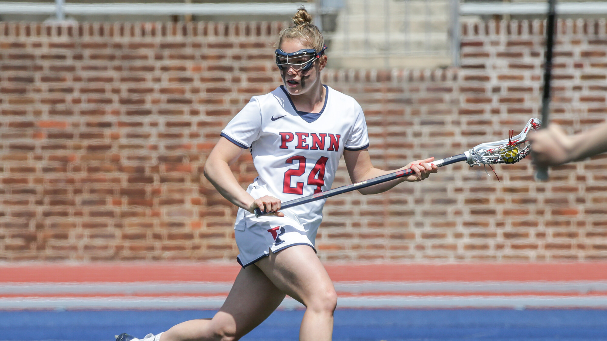 Rosenzweig running with the stick twists to look back toward the field