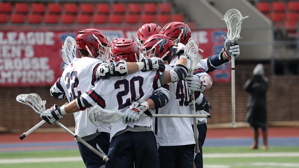Goldner and his teammates celebrate in a circle.