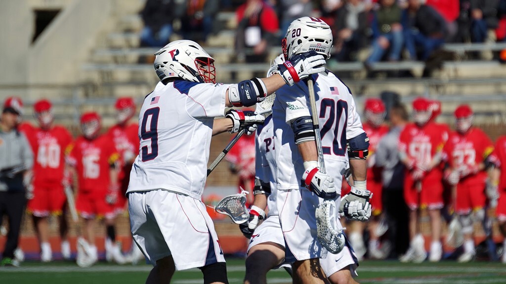 Adam Goldner and teammates celebrate against Maryland.