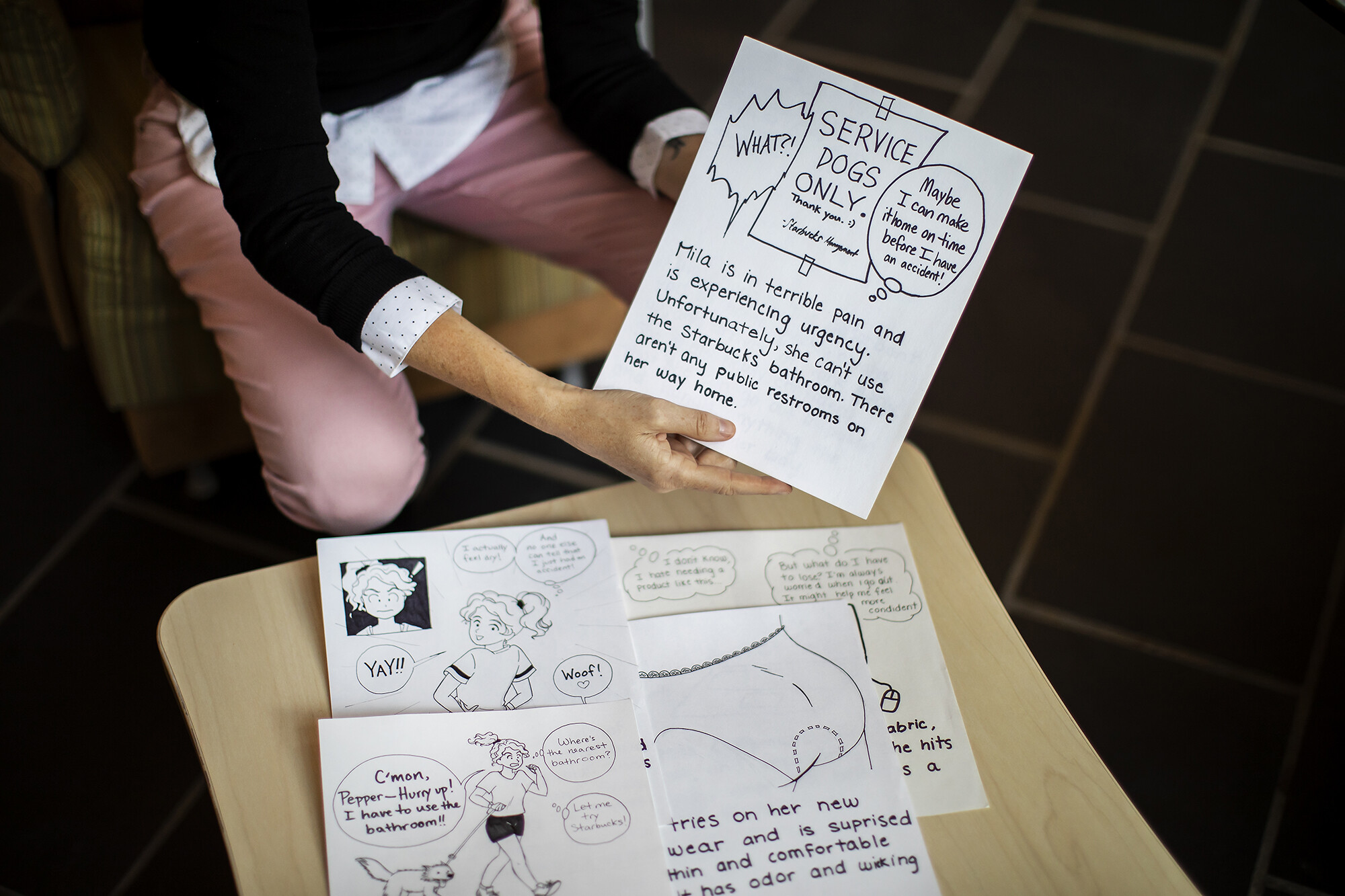 marion showing off drawings for prototype