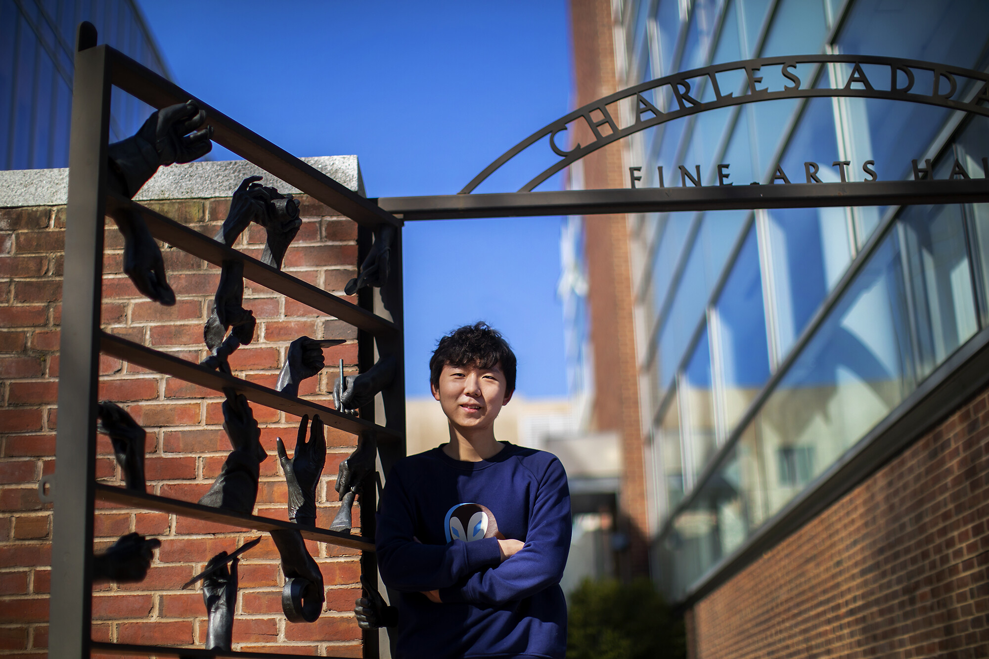 dennis kim in front of addams hall