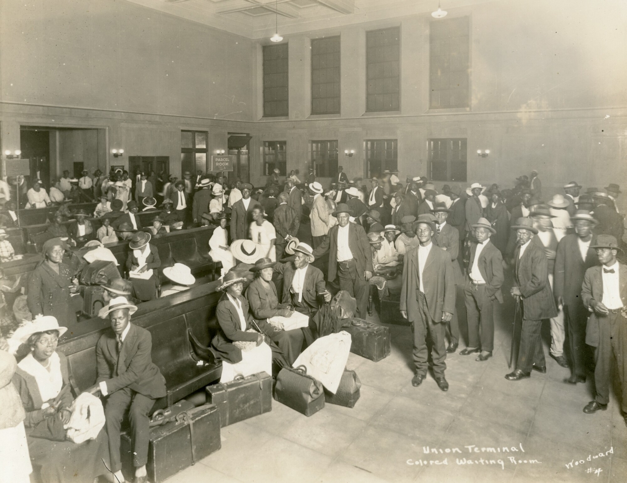 African Americans gather in a segregated waiting area at a train station