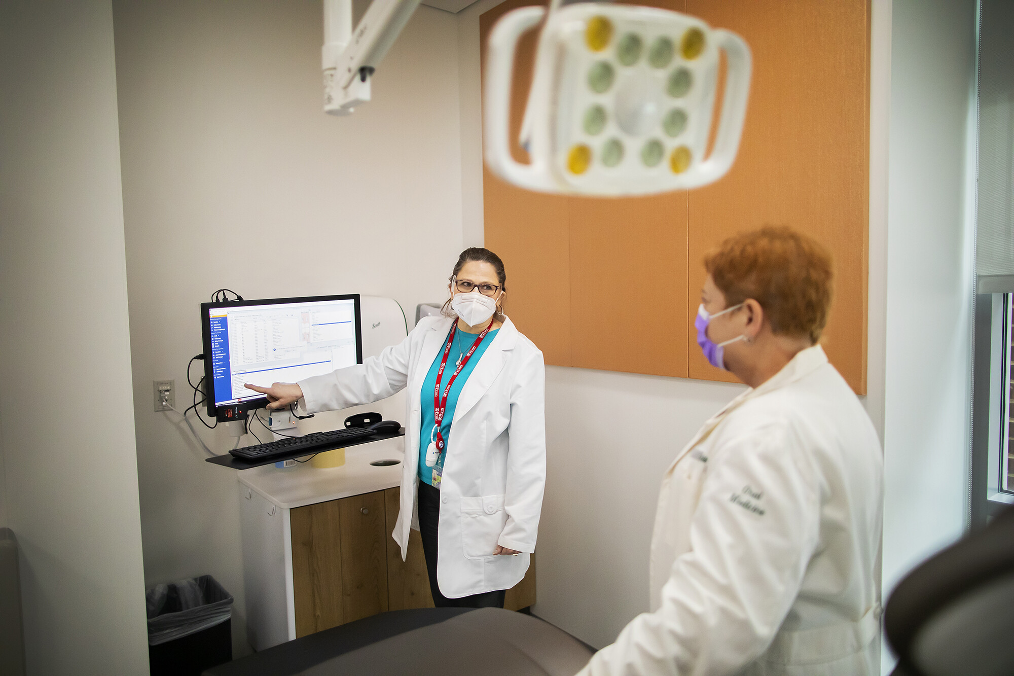 dental center director and associate director at a workstation