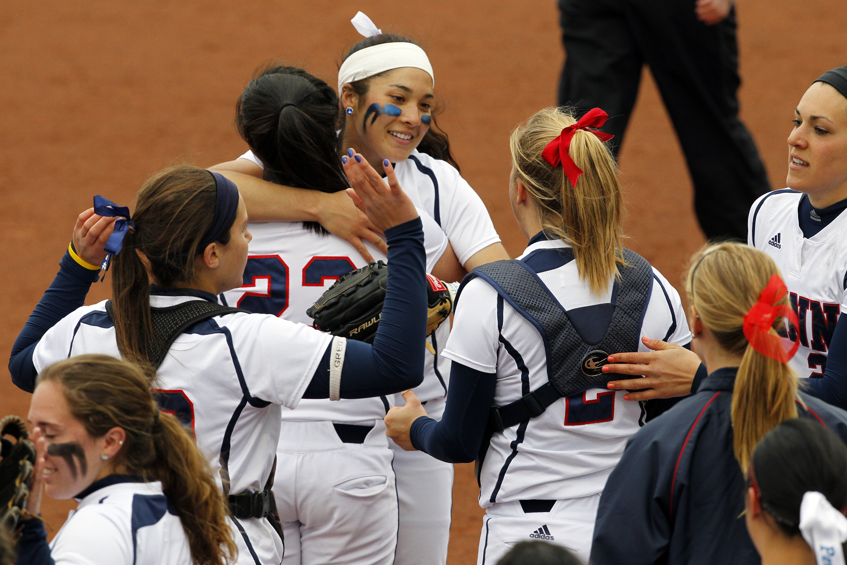 Borden celebrates with and hugs her teammates.