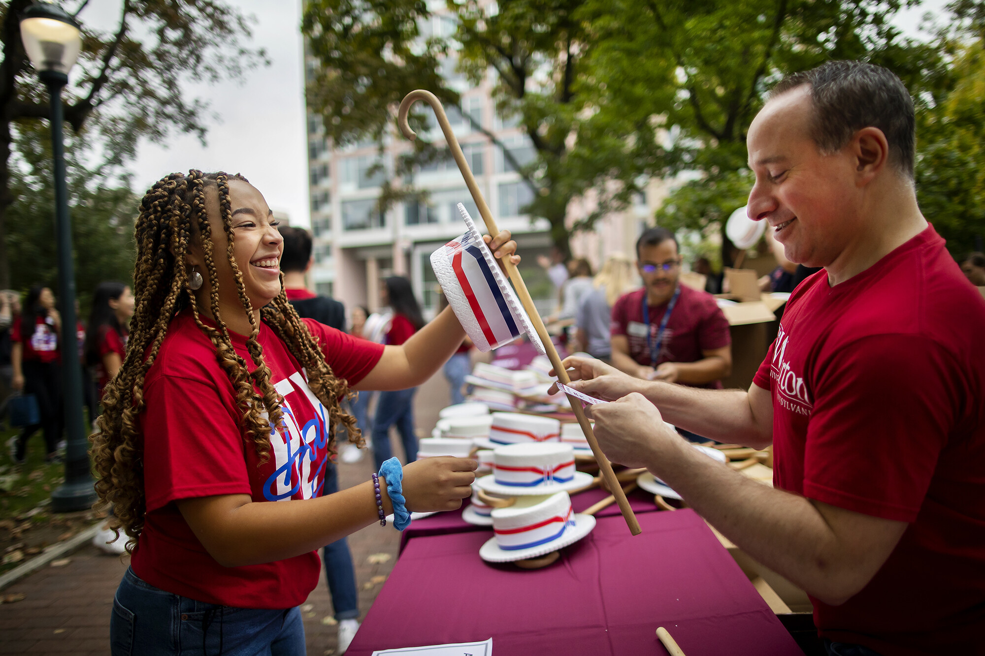handing out hats and canes at hey day