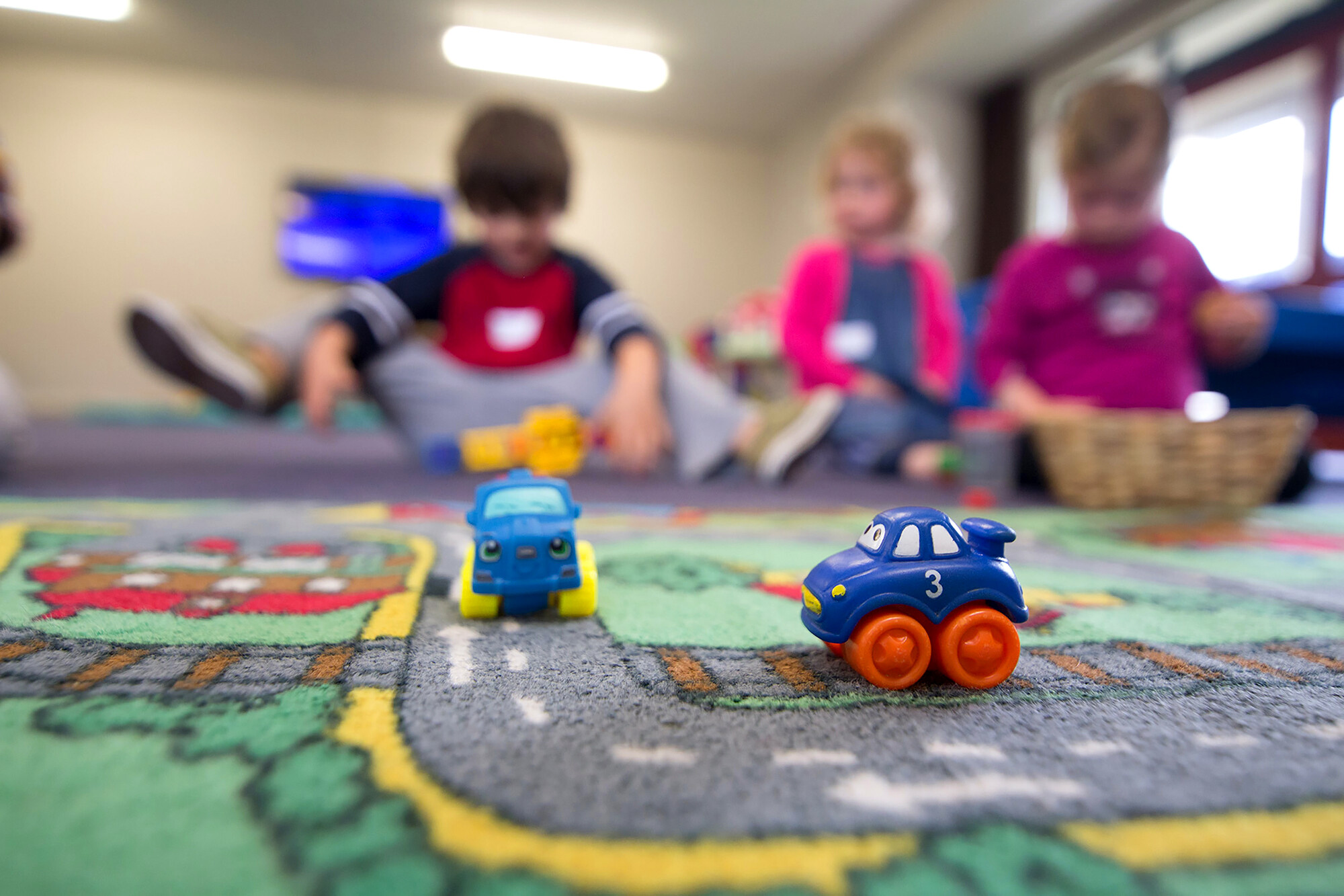 children in foster care playing on the floor