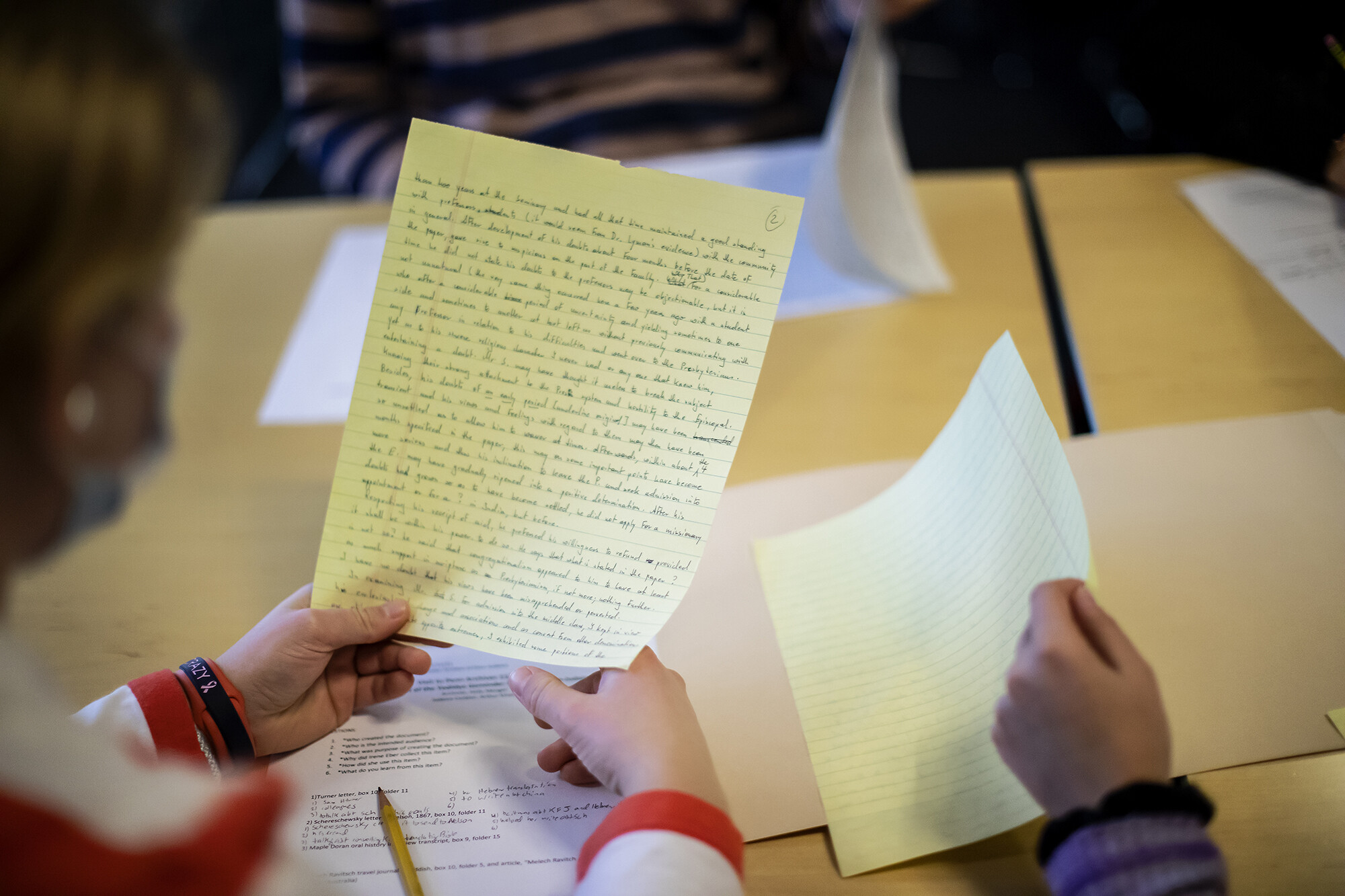 students looking and handwritten notes