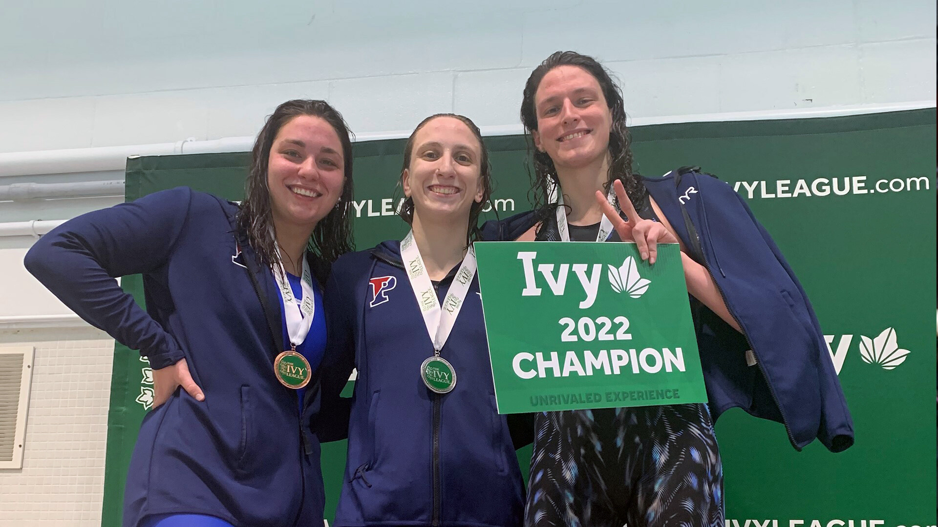 From left, Anna Kalandadze, Catherine Buroker, and Lia Thomas pose with their Ivy League Championship medals.