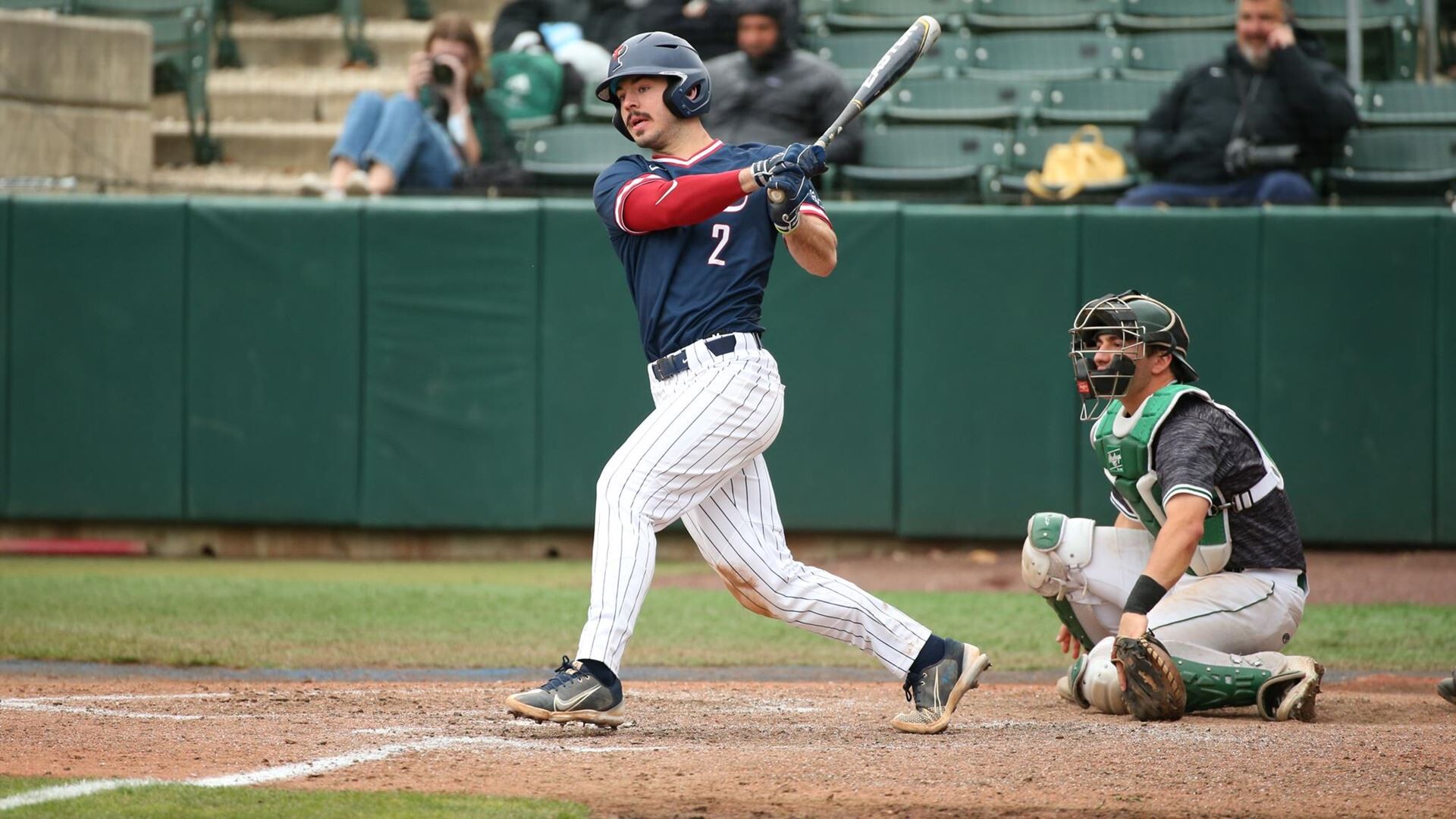 Miller watches the ball after connecting on a pitch.