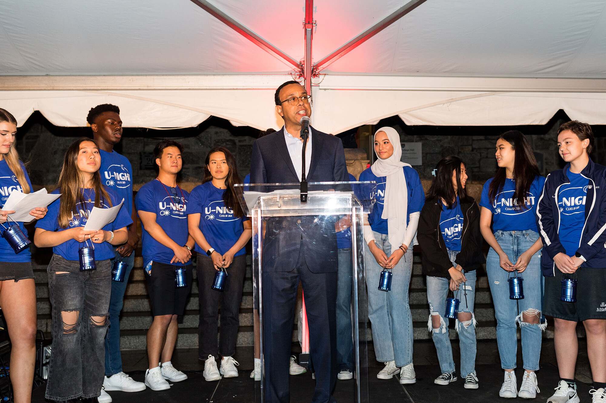 Wendell Pritchett speaks at a podium surrounded by members of the Class Board of 2022.