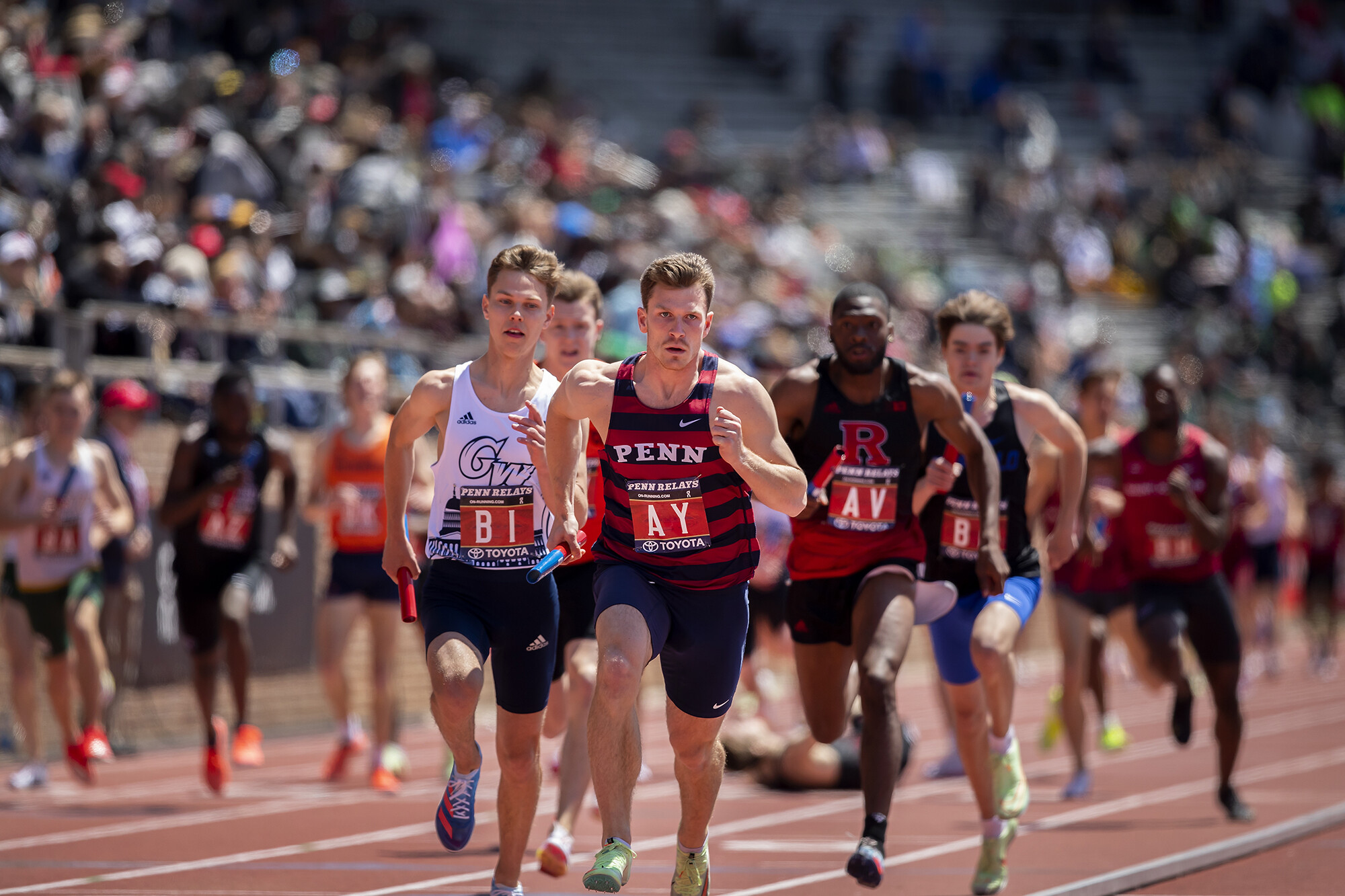 Many runners racing on a track.