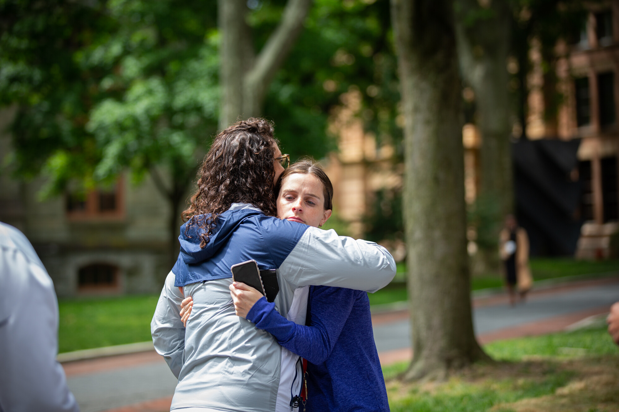 Two people hug on College Green during Penn’s gun violence vigil.