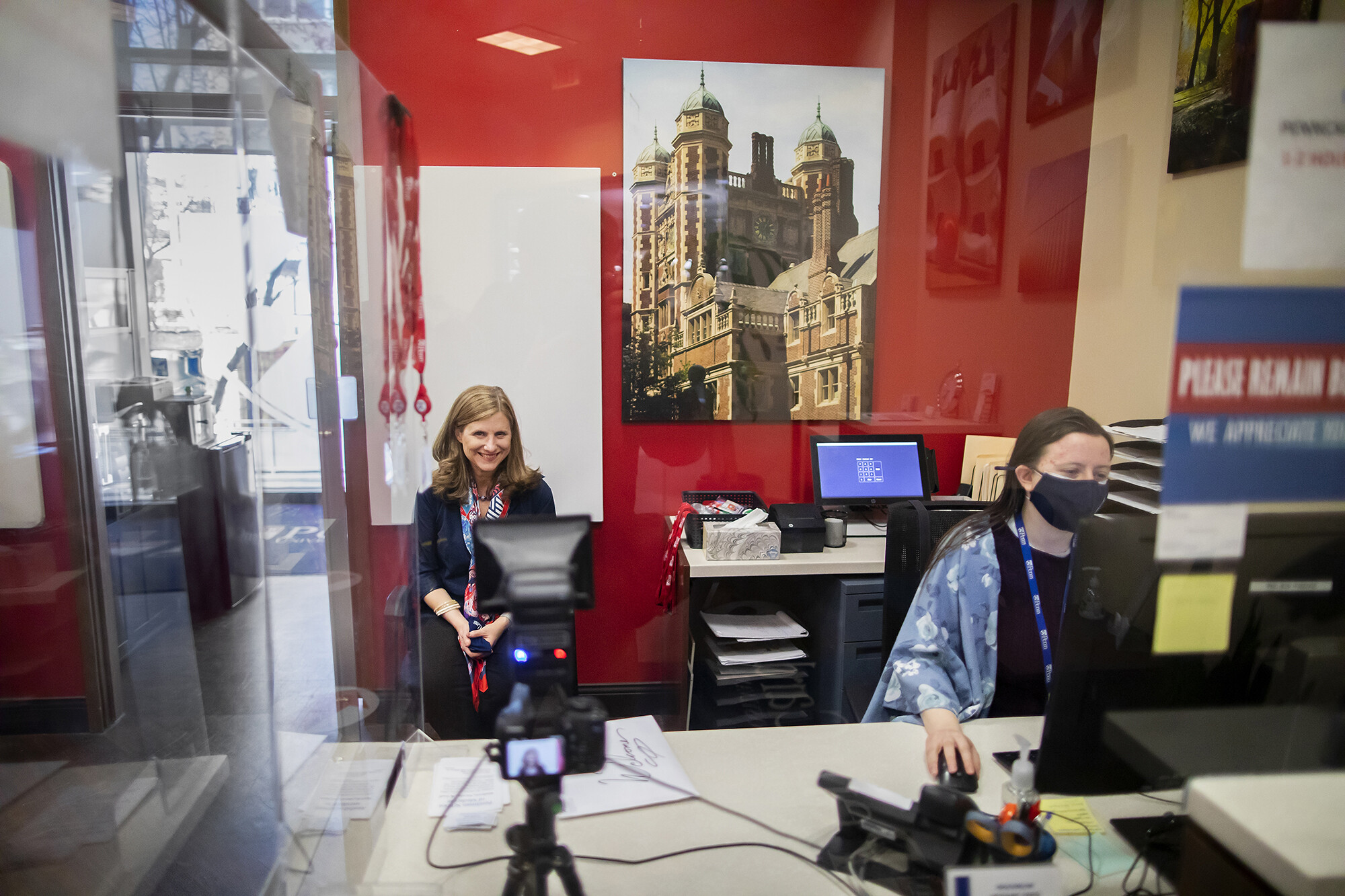 Liz Magill smiles for the camera as she gets her photo taken for her Penn Card at the Penn Bookstore.