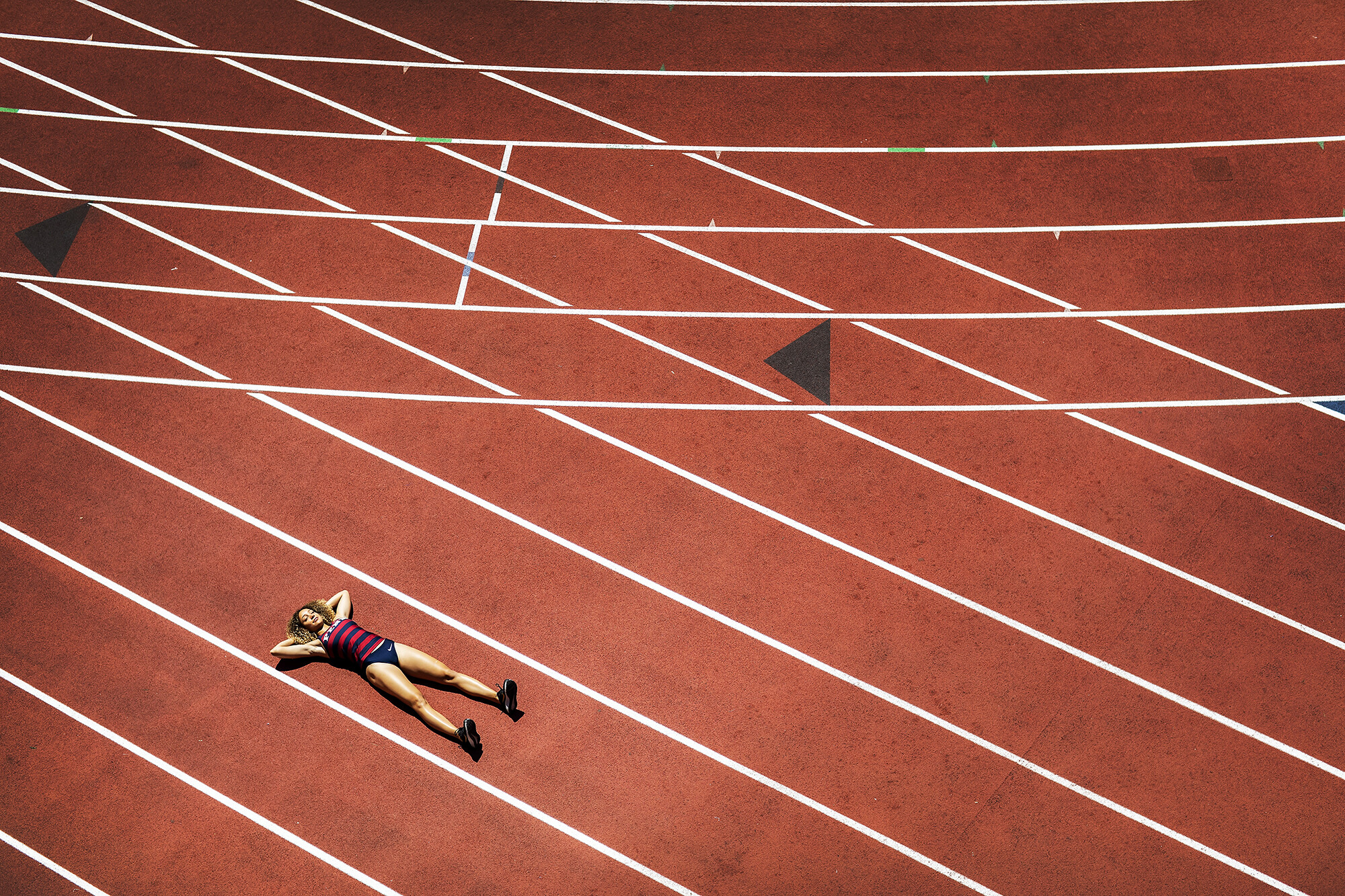 Skyla Wilson lays on the Franklin Field track.