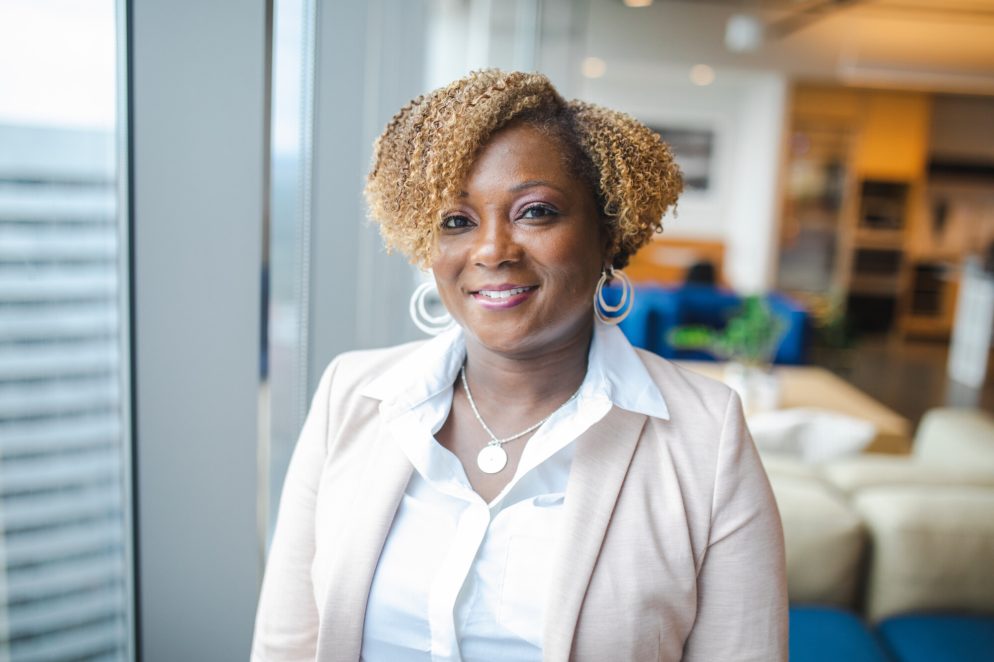 Headshot of Tyra Moore in an office