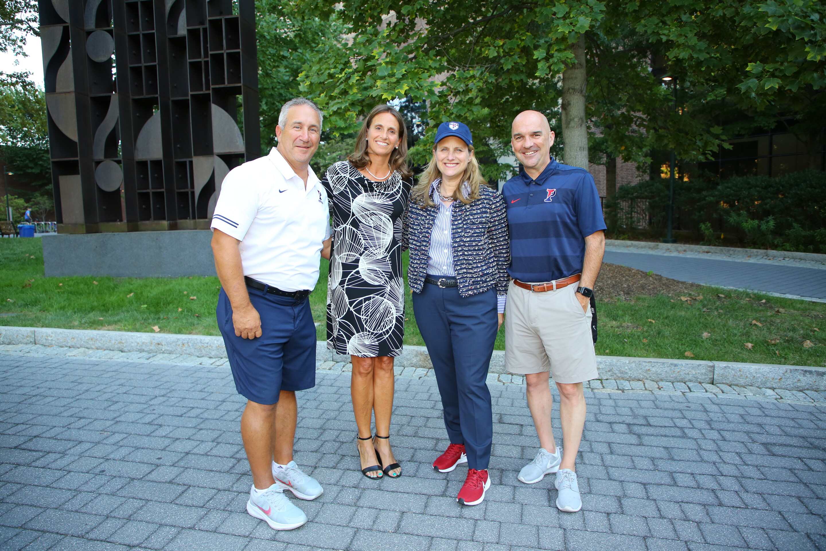 From left, Ray Priore, the head coach of the football team, Athletic Director Alanna Shanahan, President Liz Magill, and Senior Associate AD Rudy Fuller.