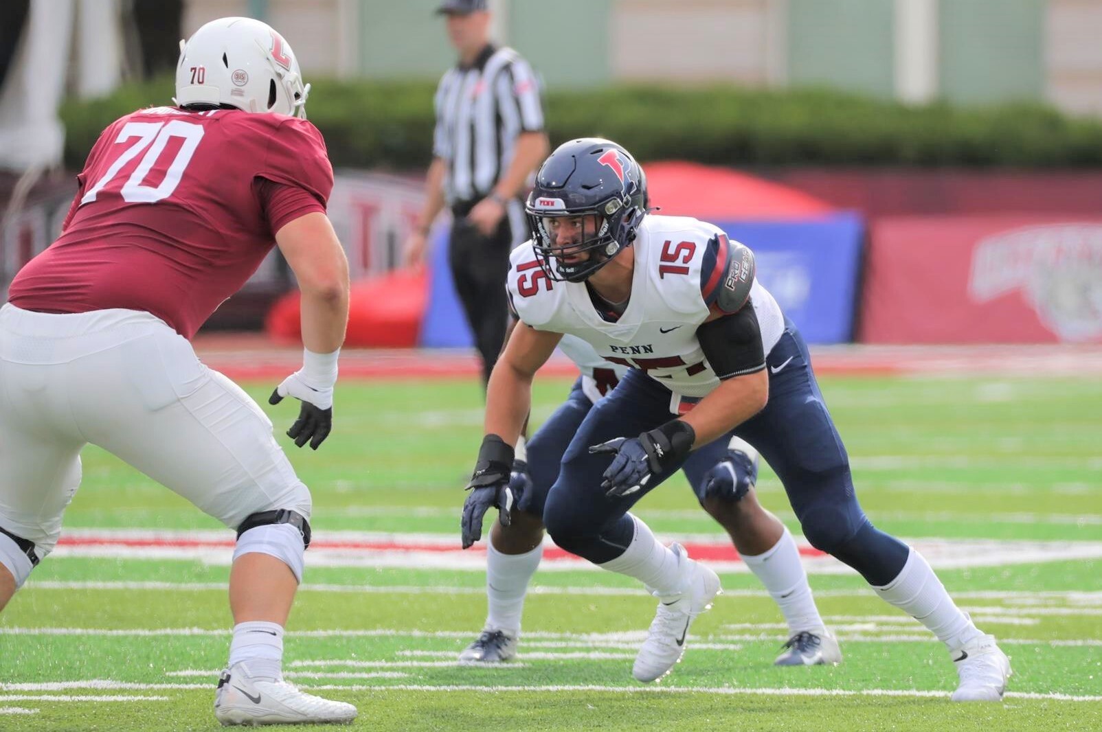 Heimlicher rushes toward a lineman after the snap of the ball.