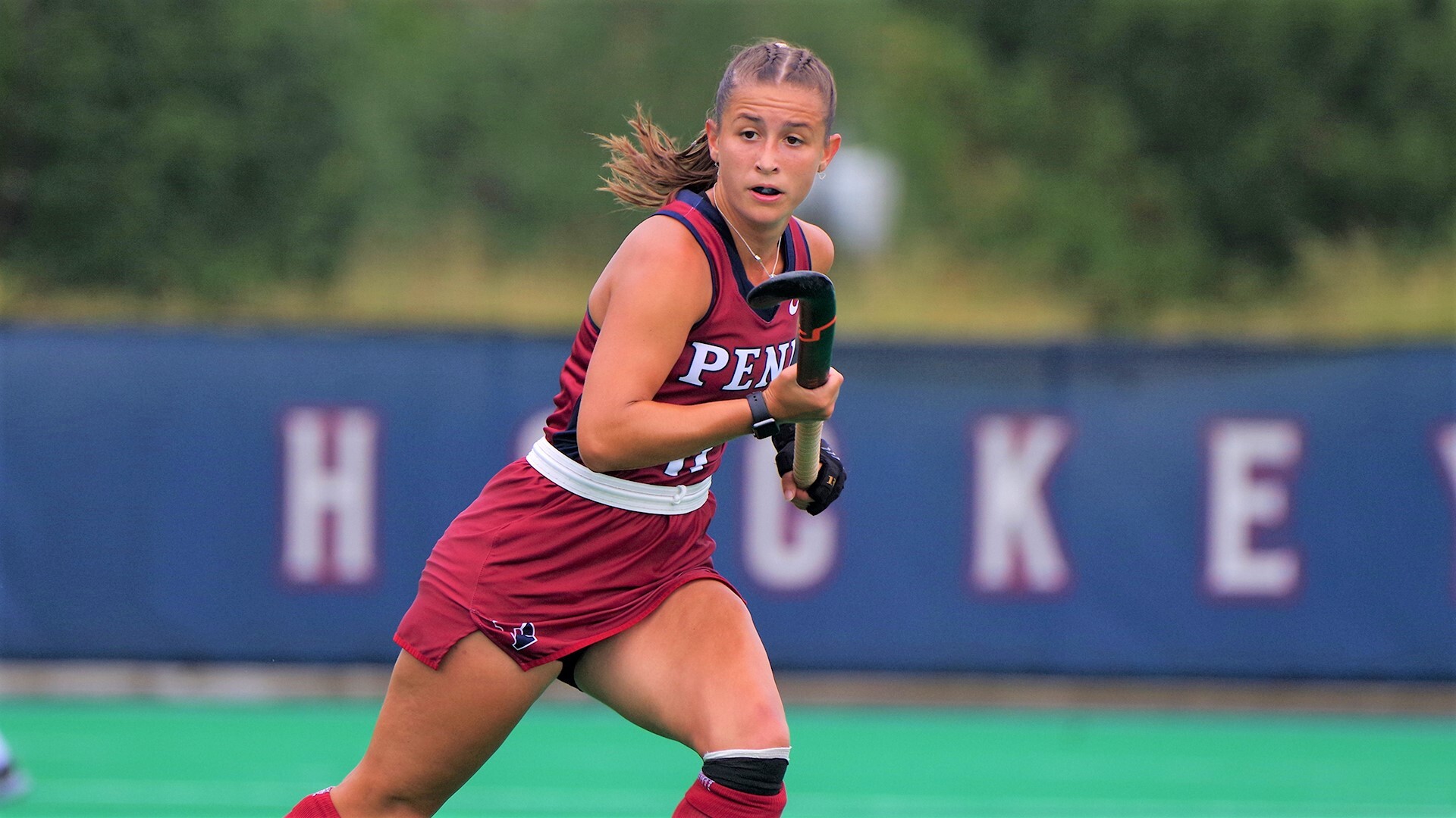 Fourth-year forward Meghan Ward runs with her stick in her hand.