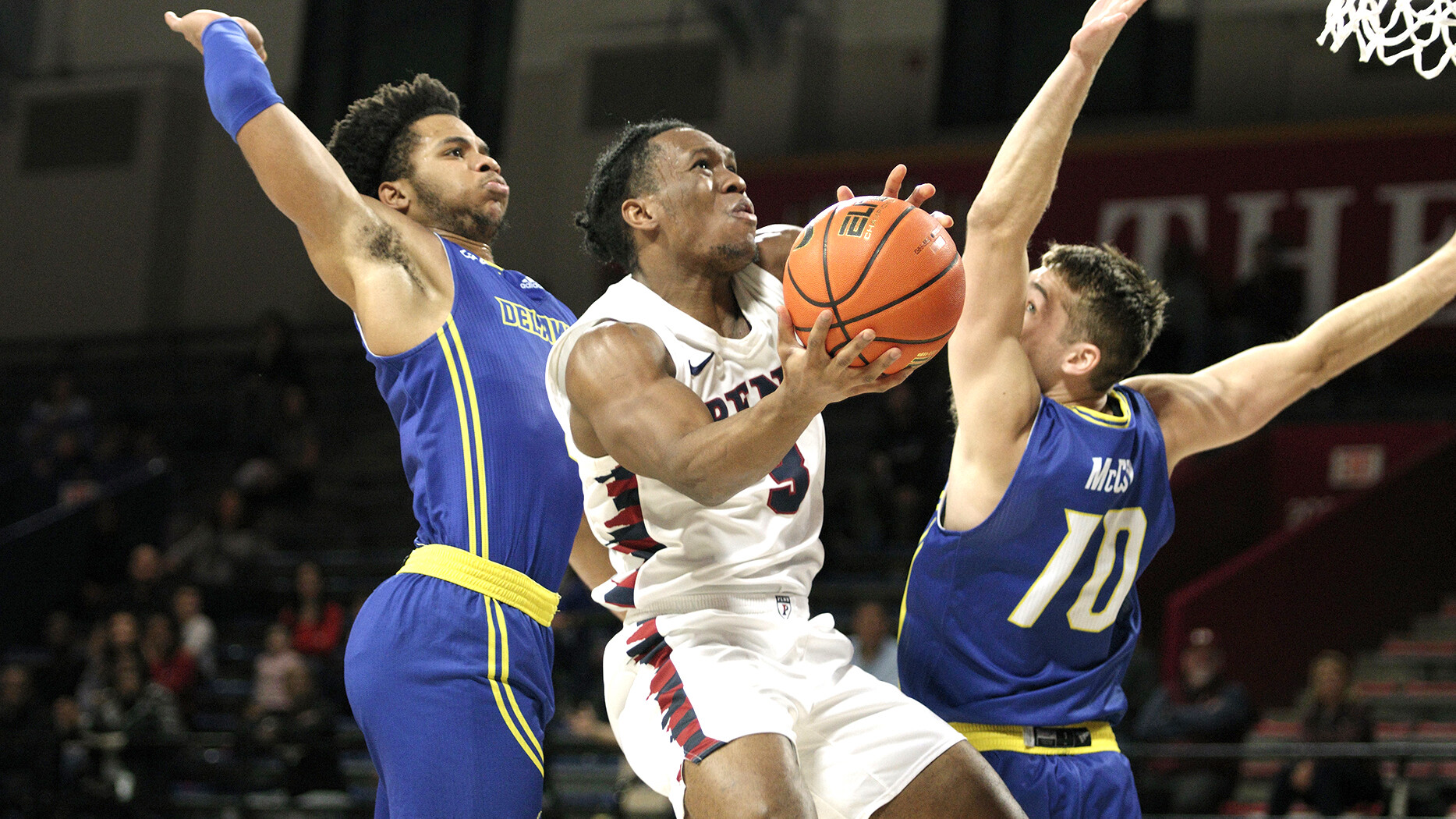 Dingle goes up for the tough shot against Delaware.
