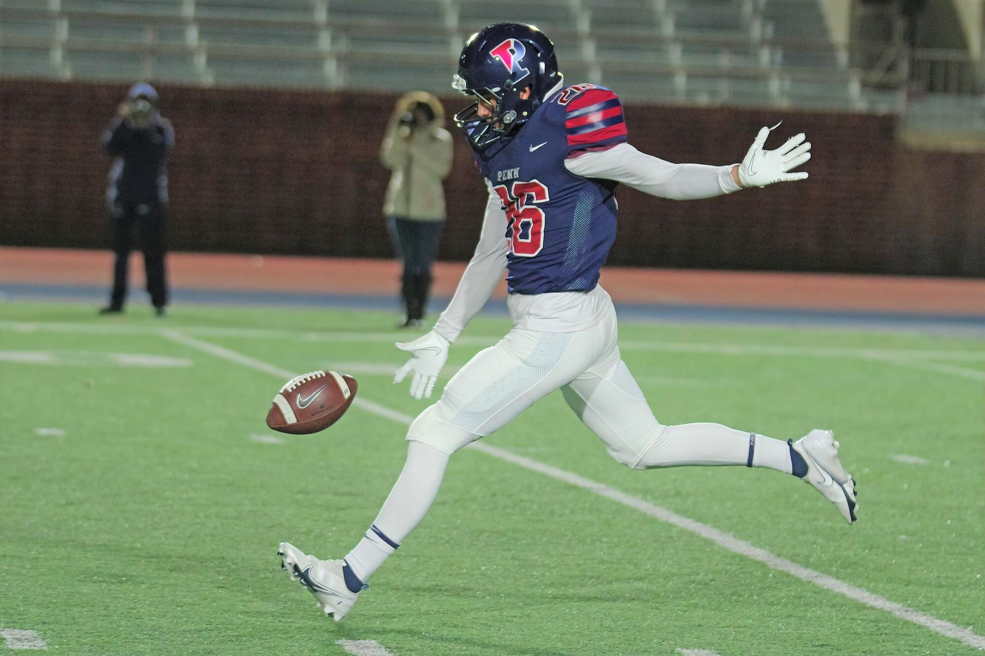 Montemayor prepares to punt the ball during a game.