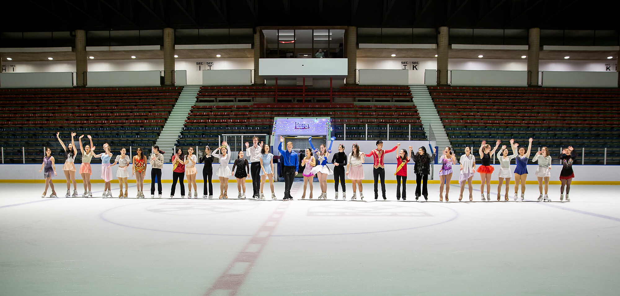 The entire skating cast of The Nutcracker in a row on the ice.