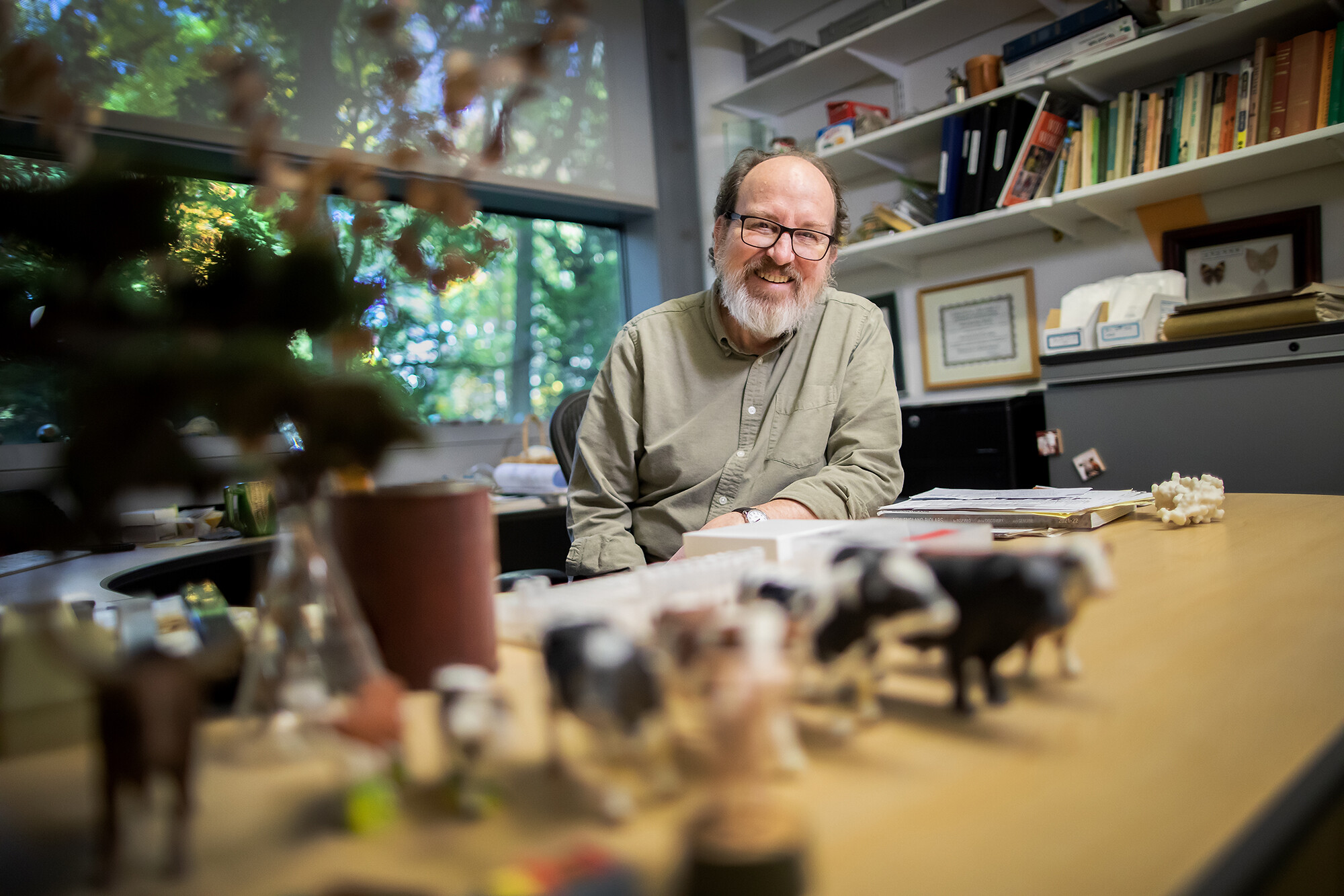 Scott Poethig sitting at his desk