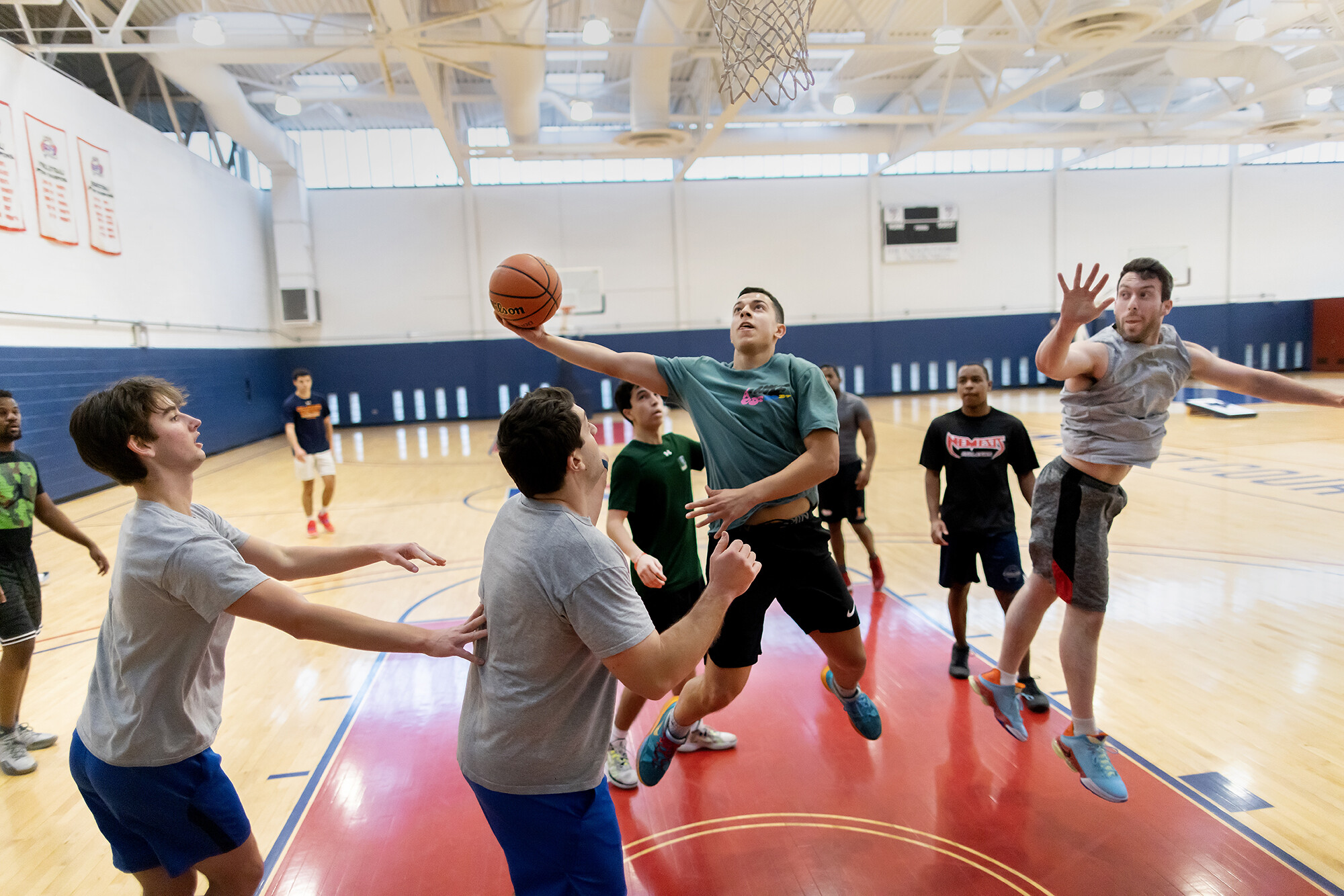 Members shoot hoops on the Jon M. Avnet basketball courts at the Pottruck Center on Friday, Jan. 20.