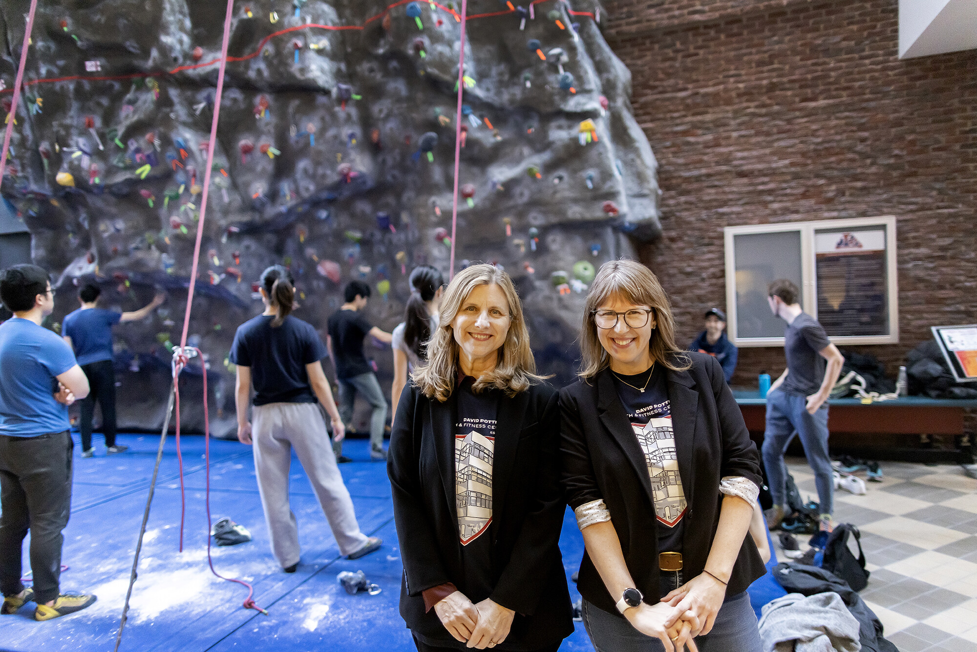 President Liz Magill, left, and Erica Hildenbrand, director of campus outreach for Penn Athletics and Recreation. 